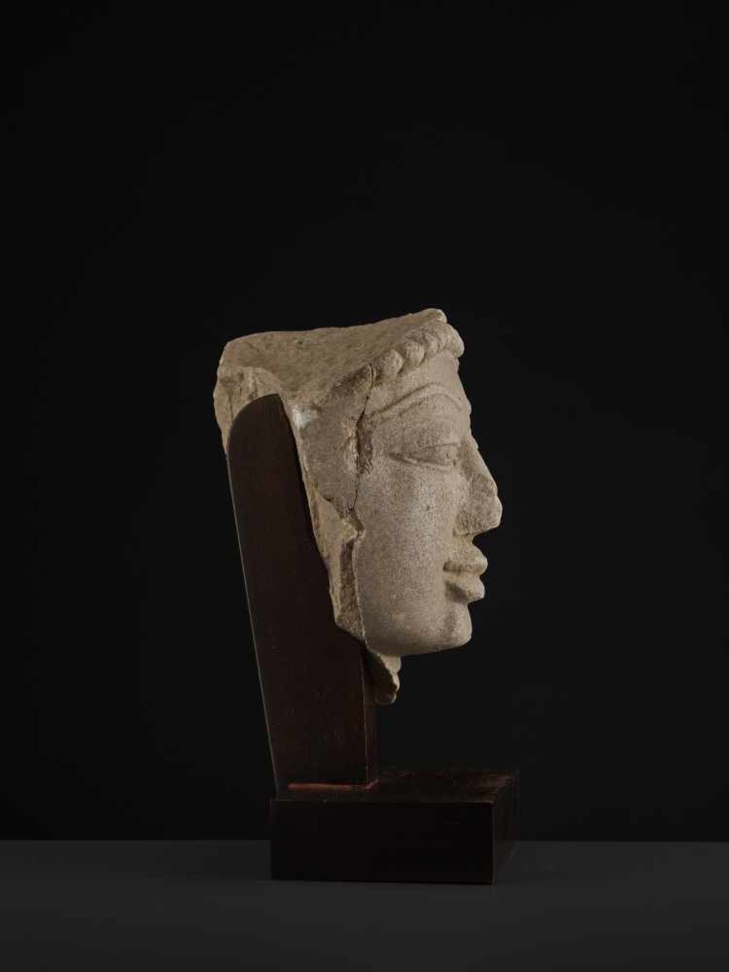 A SANDSTONE HEAD OF A TIRTHANKARACentral India, 11th - 13th century. A large and finely carved - Image 6 of 9