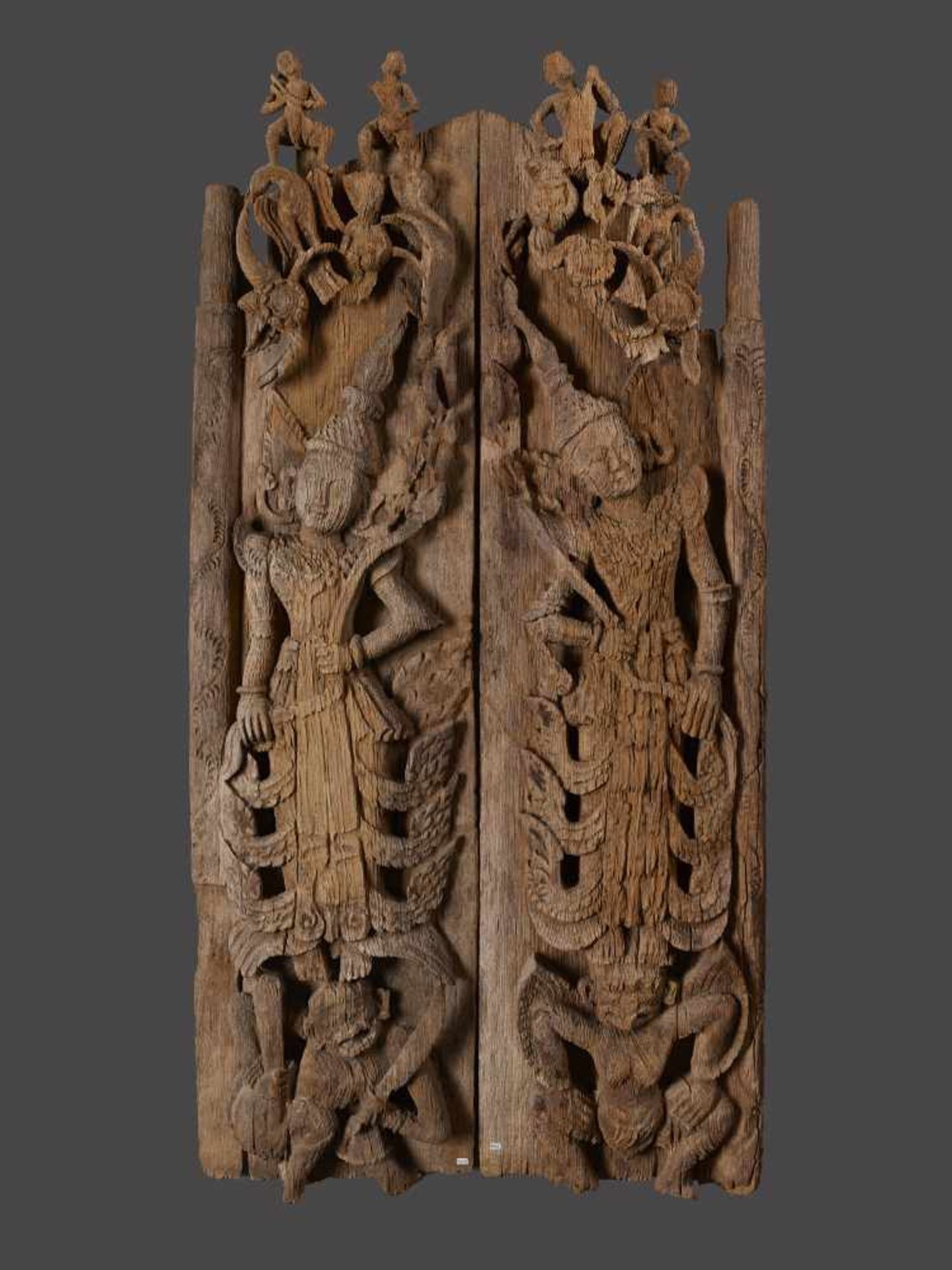 A PAIR OF BURMESE TEMPLE DOORSBurma / Myanmar, 18th - 19th century. Carved teak wood. Each with