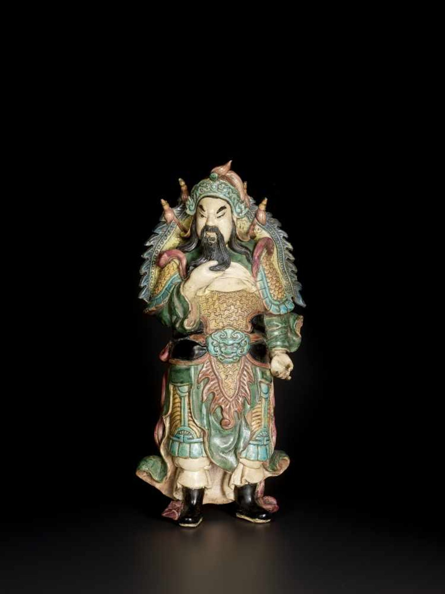 A FAHUA STATUE OF GUANDI, QINGChina, 17th-19th century. The neatly modelled figure glazed in