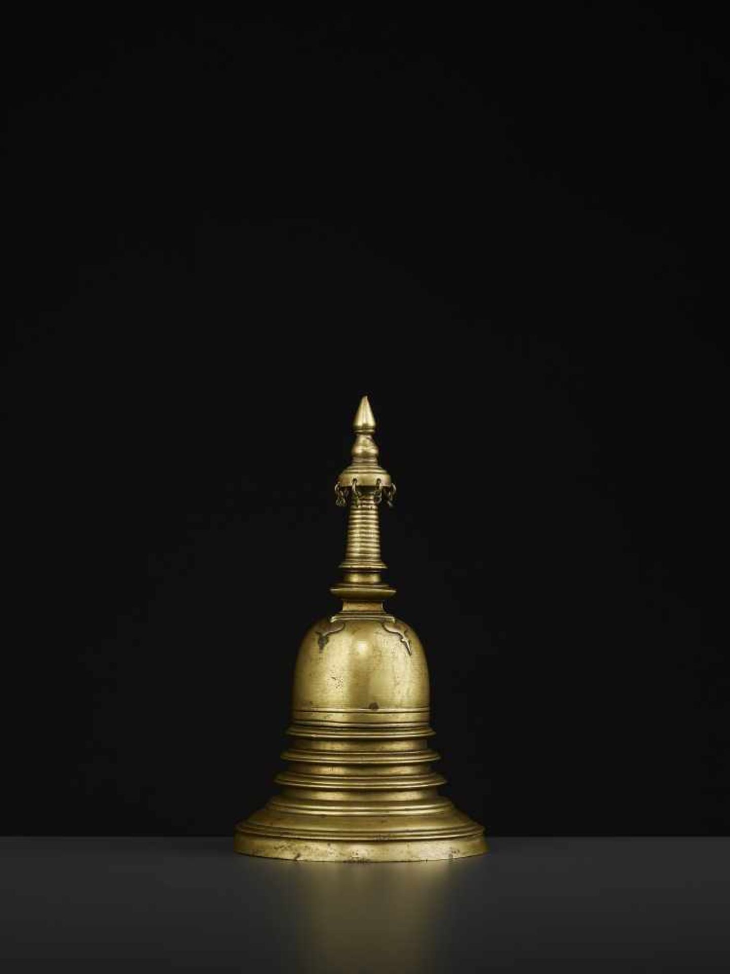 A 19TH CENTURY RELIQUARY STUPA South East Asia, 19th century. The bronze stupa with its originally