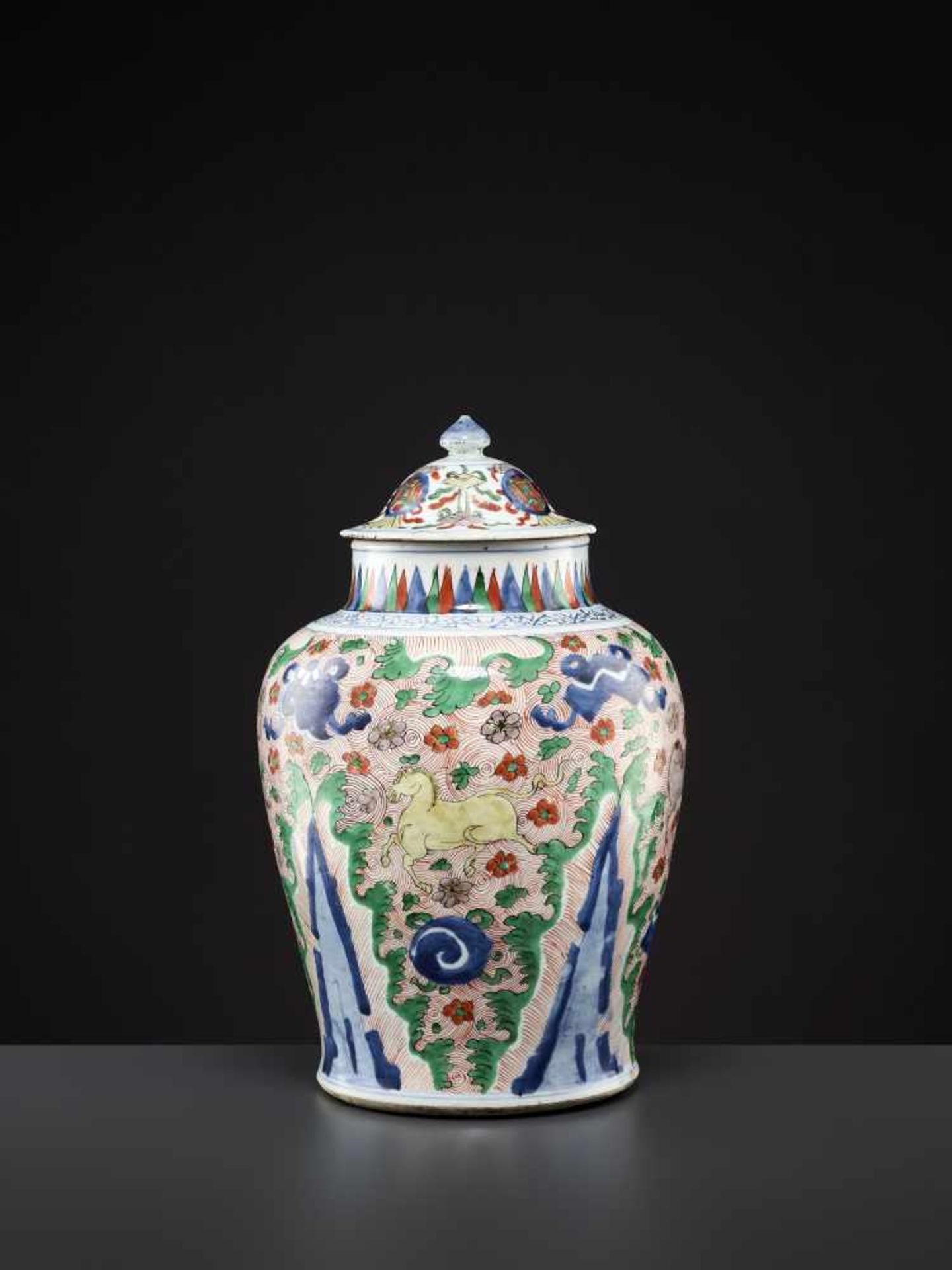 A LIDDED WUCAI VASE, MING DYNASTY China, 16th - 17th century. Freely painted in underglaze blue,