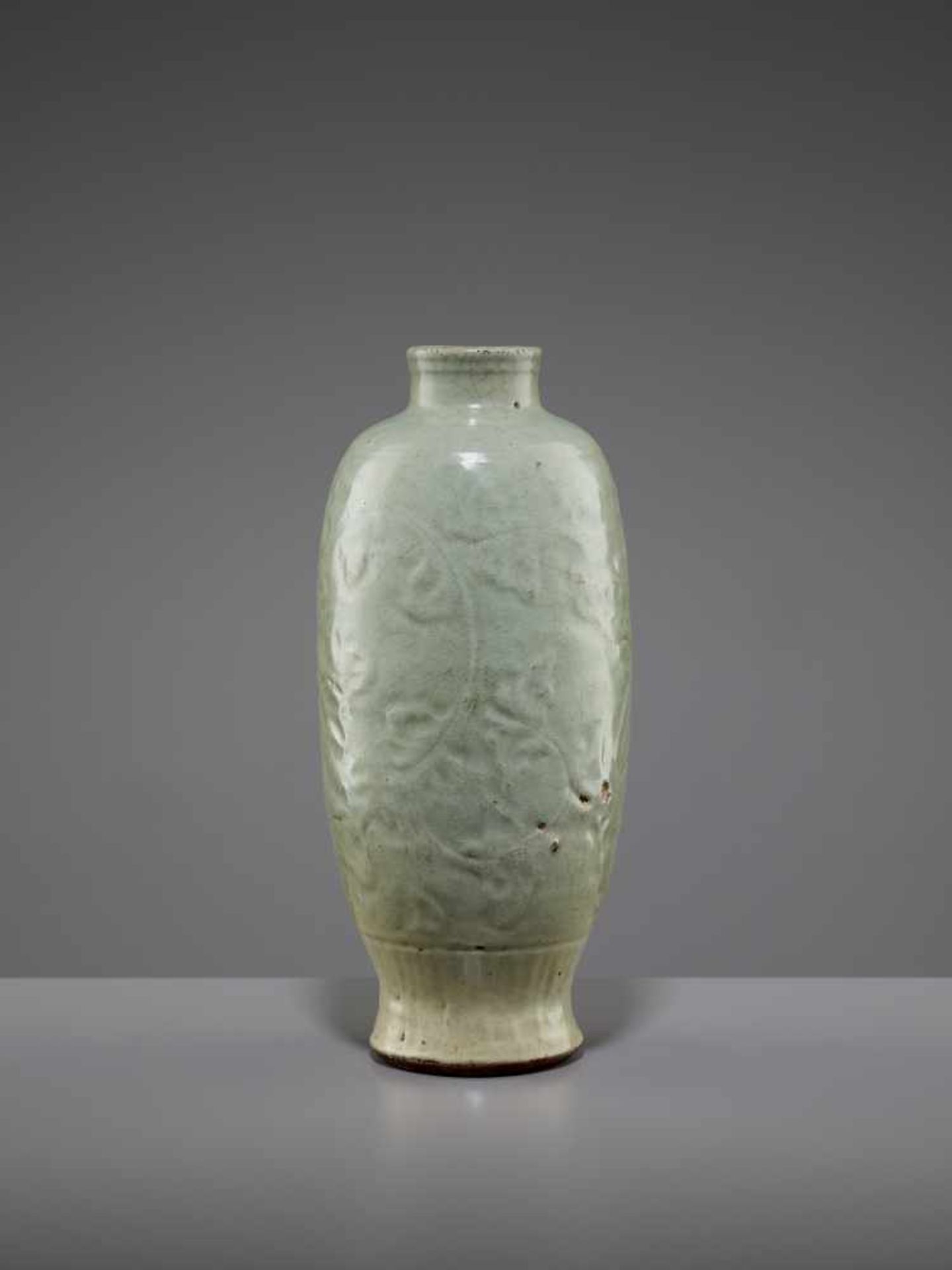 A LONQUAN CELADON VASE, MINGChina, 15th-16th century. The massively potted vessel with a vitreous,