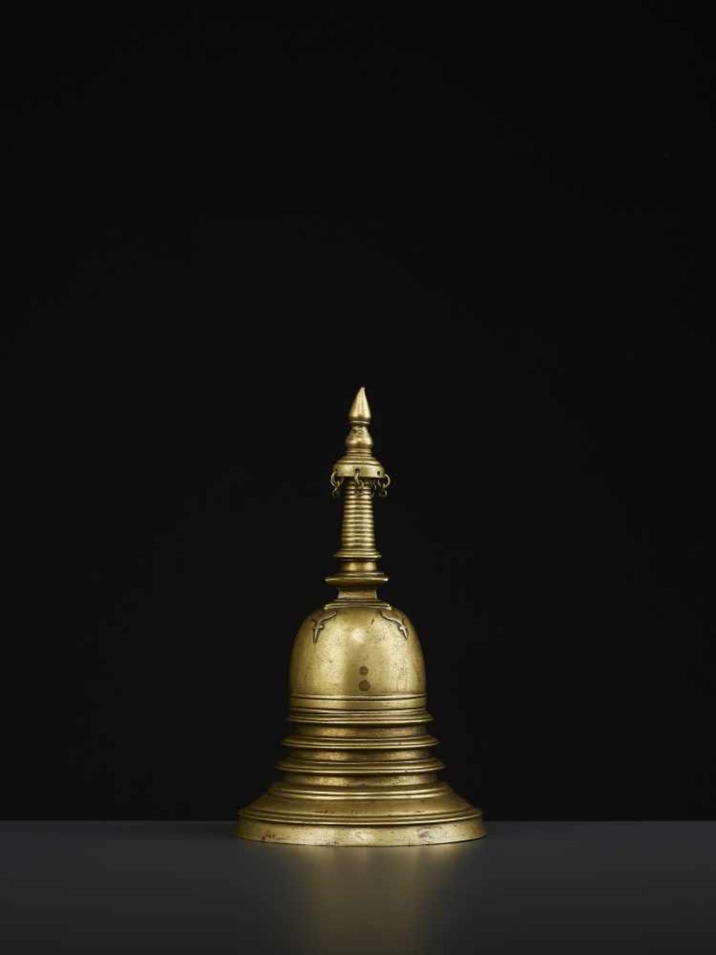 A 19TH CENTURY RELIQUARY STUPA South East Asia, 19th century. The bronze stupa with its originally - Image 4 of 8