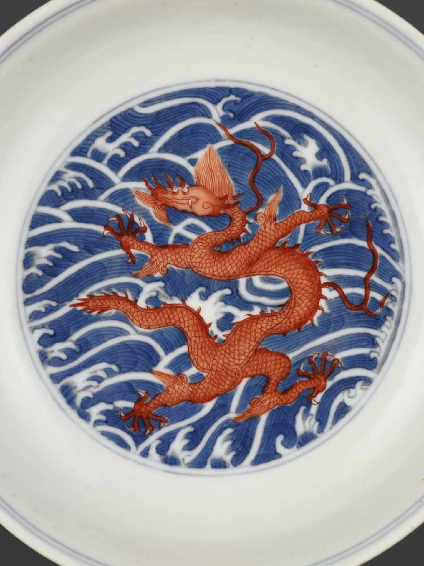 A DAOGUANG MARK & PERIOD DRAGON DISHChina, 1821-1850. Porcelain painted in iron red and underglaze- - Image 6 of 10