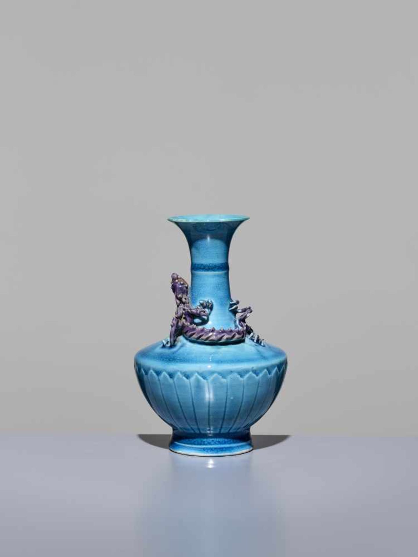 A CHILONG VASE, EARLY 18TH CENTURYChina, 1700-1750. The aubergine-glazed sinuous dragon finely