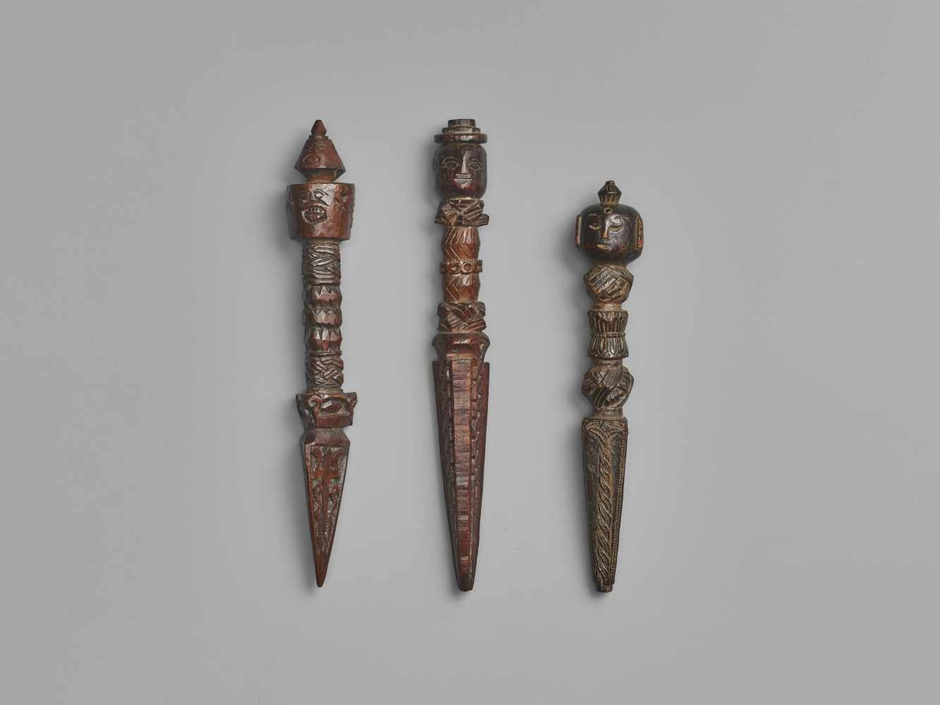 THREE NEPALESE CARVED WOOD PHURBUS Nepal, 17th-19th century. This lot comprises three phurbus, - Image 6 of 6
