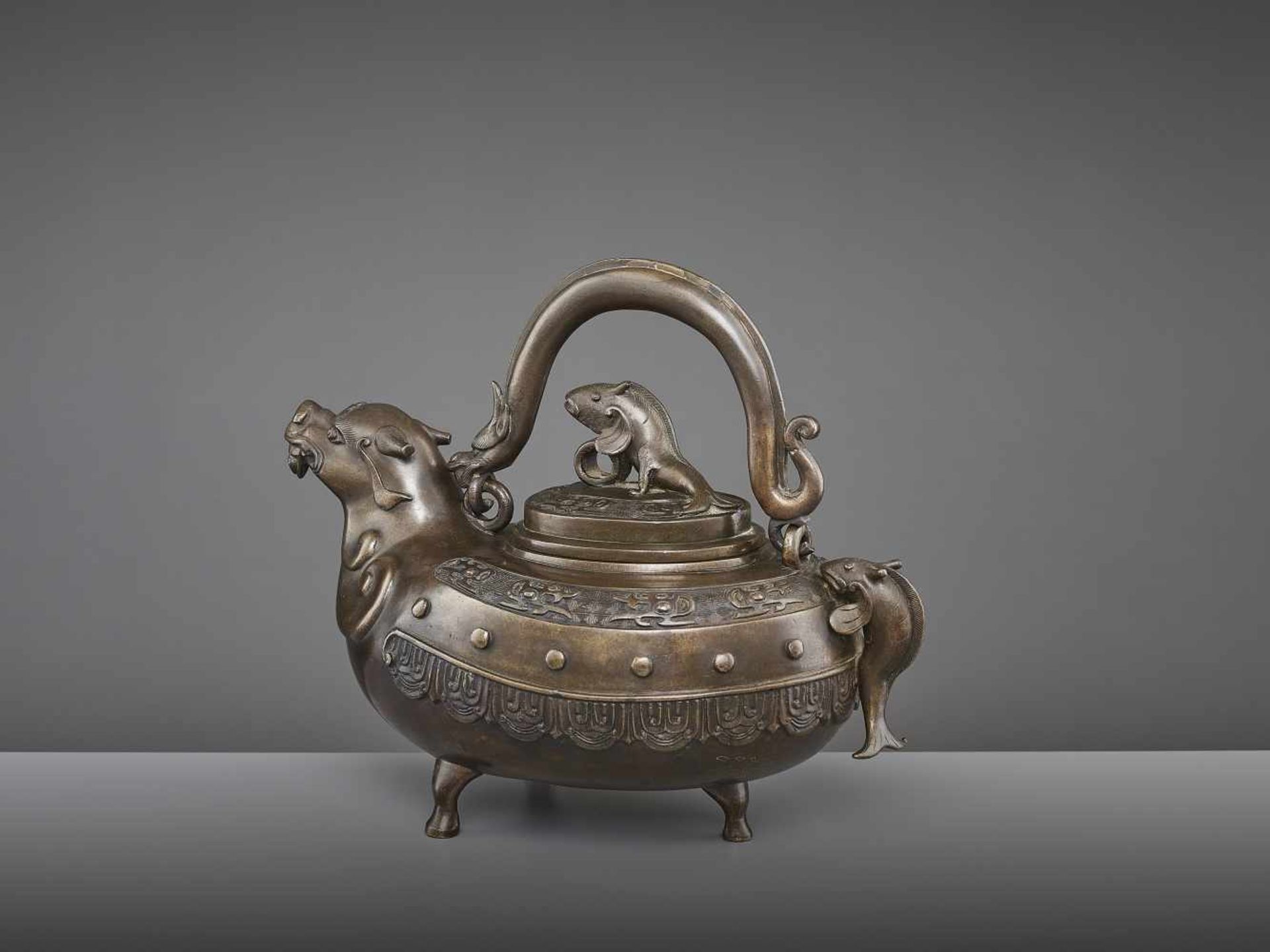 A BRONZE DRAGON EWER, QING China, 18th - 19th century. The lidded tripod vessel with a dragon head - Image 2 of 9