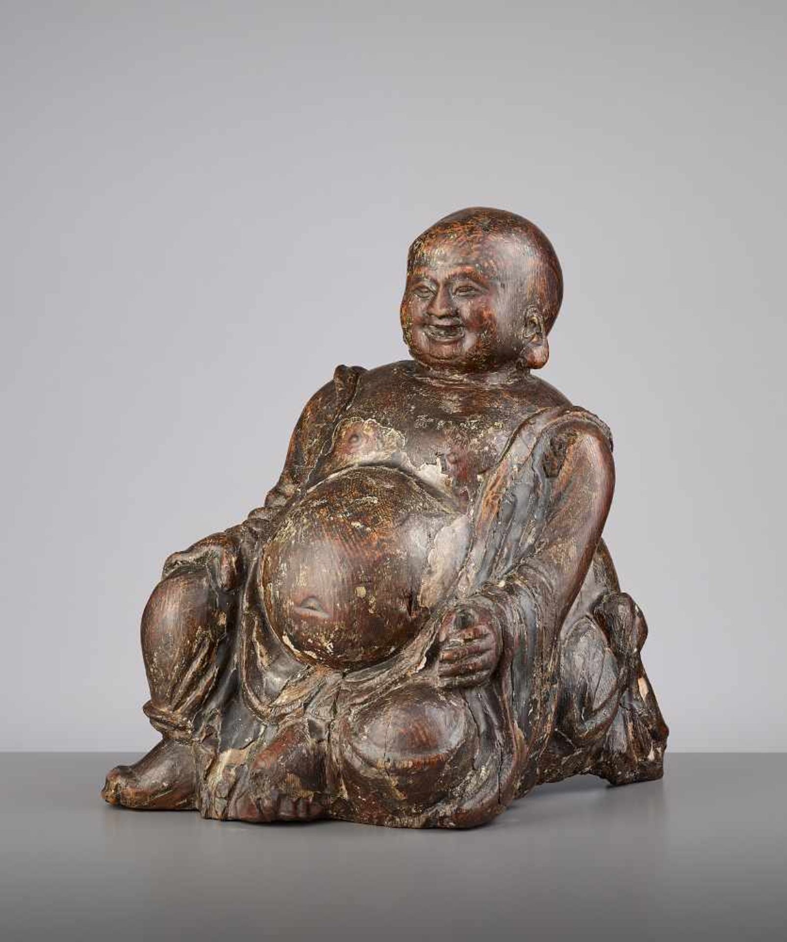 AN EXPRESSIVE WOOD BUDAI, MINGChina, 15th - 16th century. This earthy yet radiant sculpture of Budai - Image 3 of 9