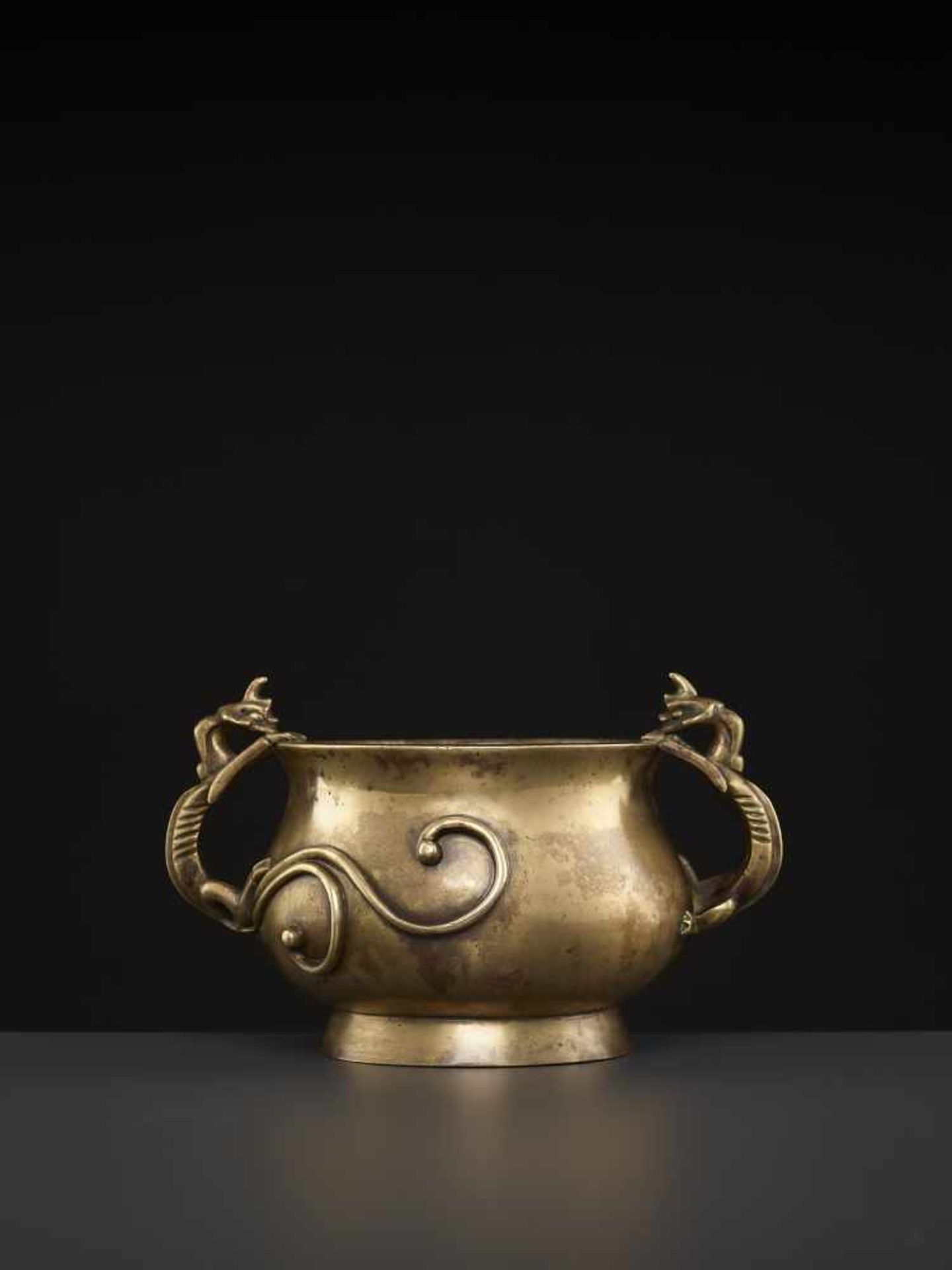 A LARGE CHILONG BRONZE CENSER, QINGChina, 1780-1880. The massive vessel raised from a sprawling foot