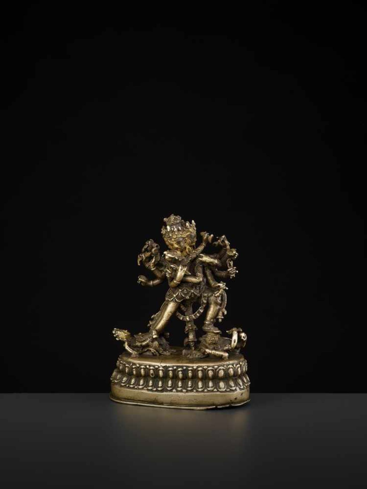 A CAKRASAMVARA BRONZE 17TH CENTURY Nepal. The four-headed and twelve-armed Cakrasamvara entangled by - Image 5 of 15