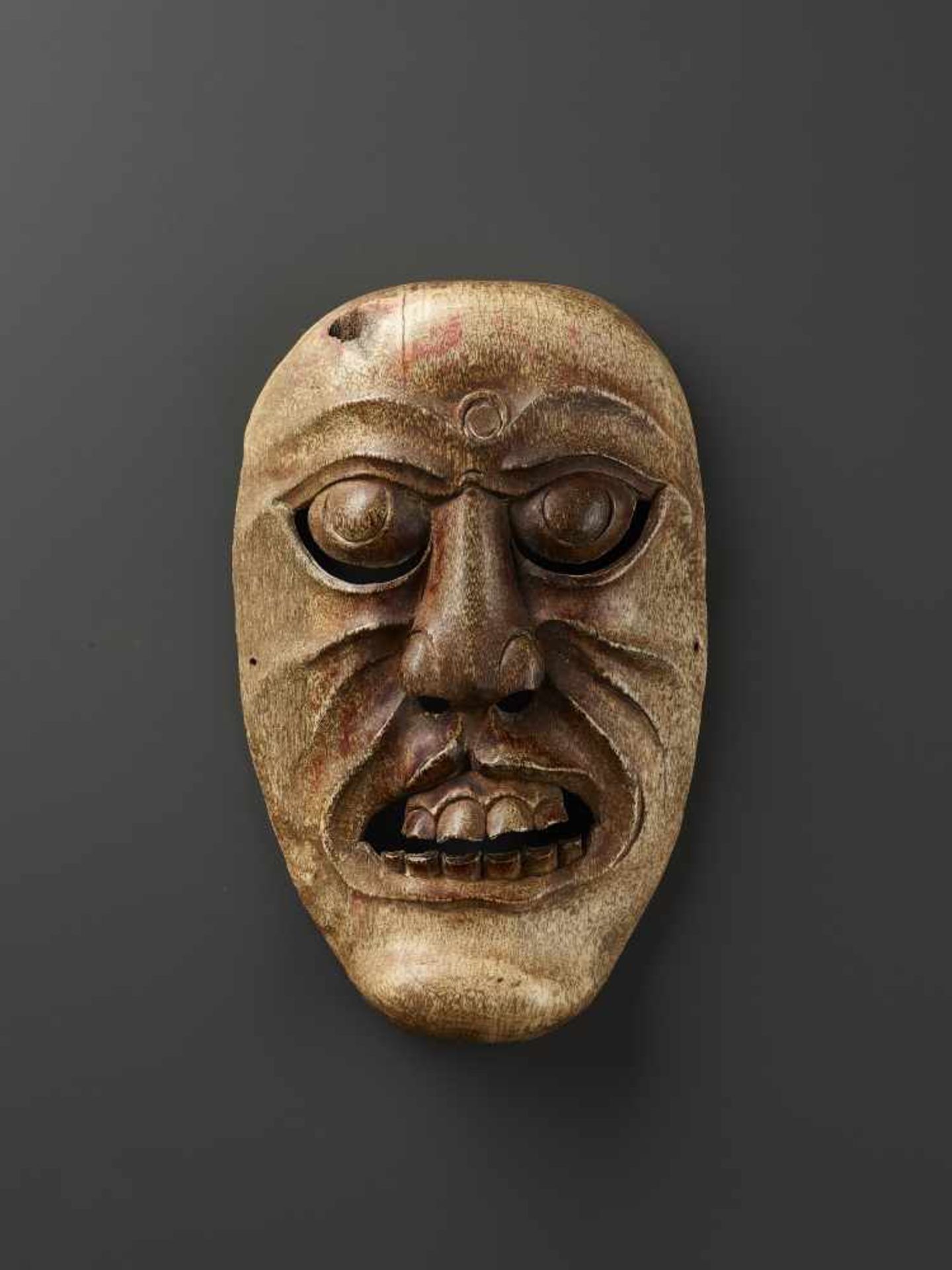 A TIBETAN YAK BONE SHAMAN MASK Tibet, 18th-19th century. Vigorously carved openwork mask with