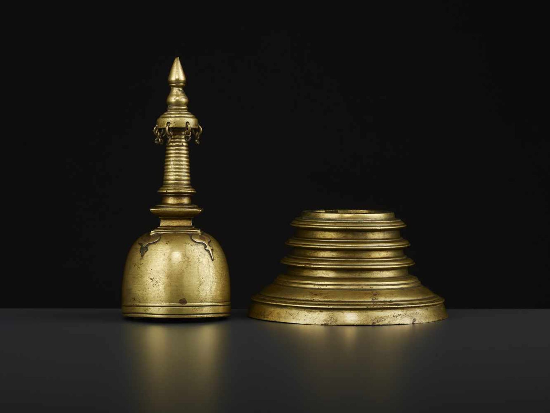 A 19TH CENTURY RELIQUARY STUPA South East Asia, 19th century. The bronze stupa with its originally - Image 2 of 8