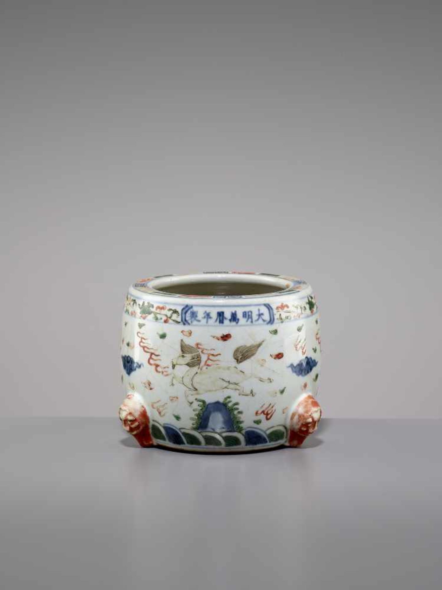 A WANLI MARK & PERIOD WUCAI JARChina, 1572-1620. The barrel-shaped jar with three mythical beasts