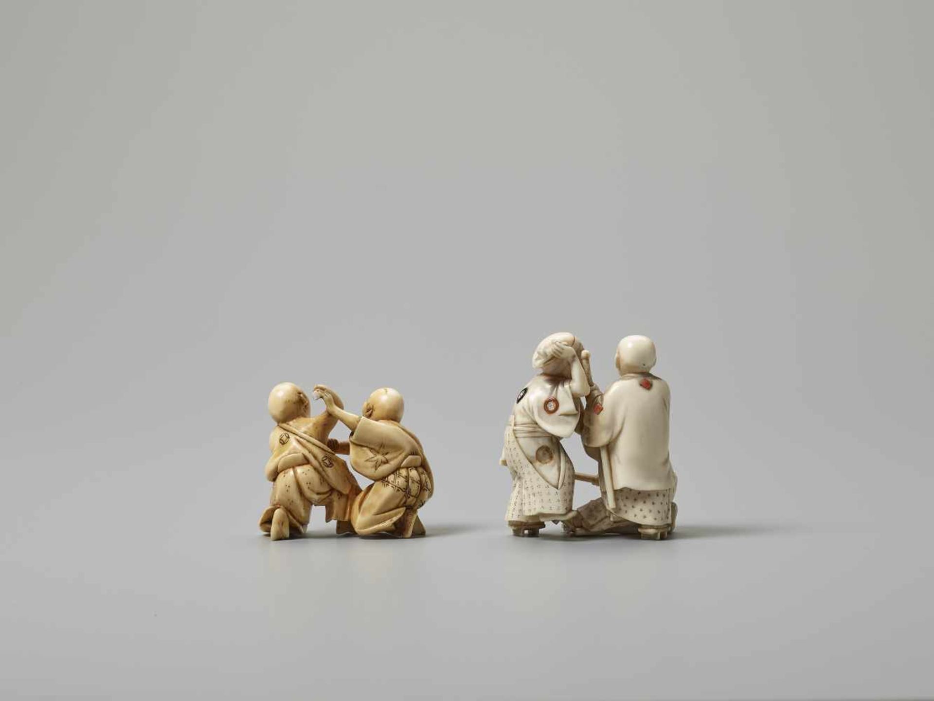 TWO IVORY NETSUKE OF BLIND MEN FIGHTING Unsigned, one with inlaysJapan, Meiji period (1868-1912) - Image 2 of 3