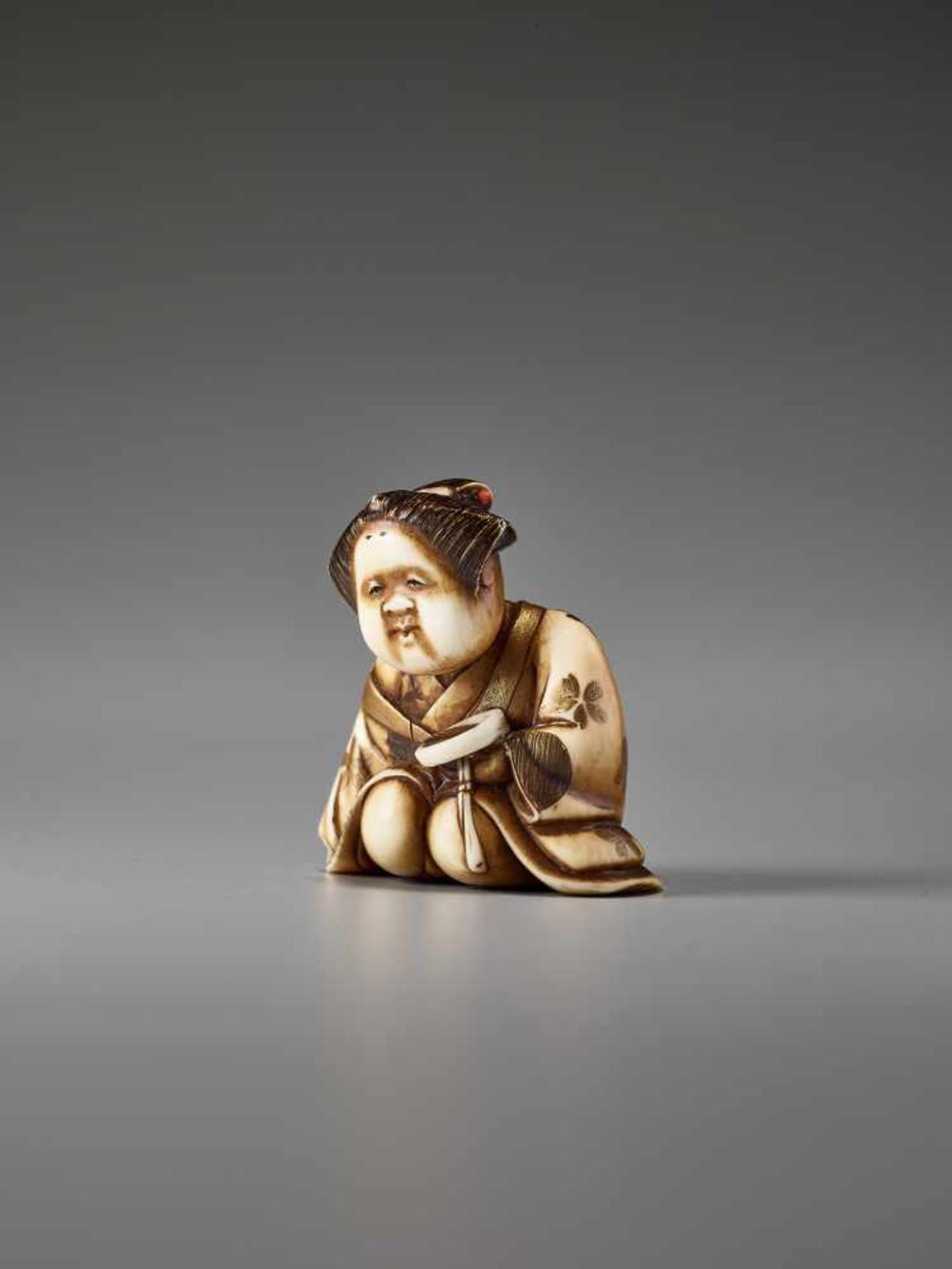 AN IVORY AND LACQUER NETSUKE OF OKAME WITH A SAKE CUP BY KEIMIN By Keimin, ivory netsuke with gold - Image 3 of 7