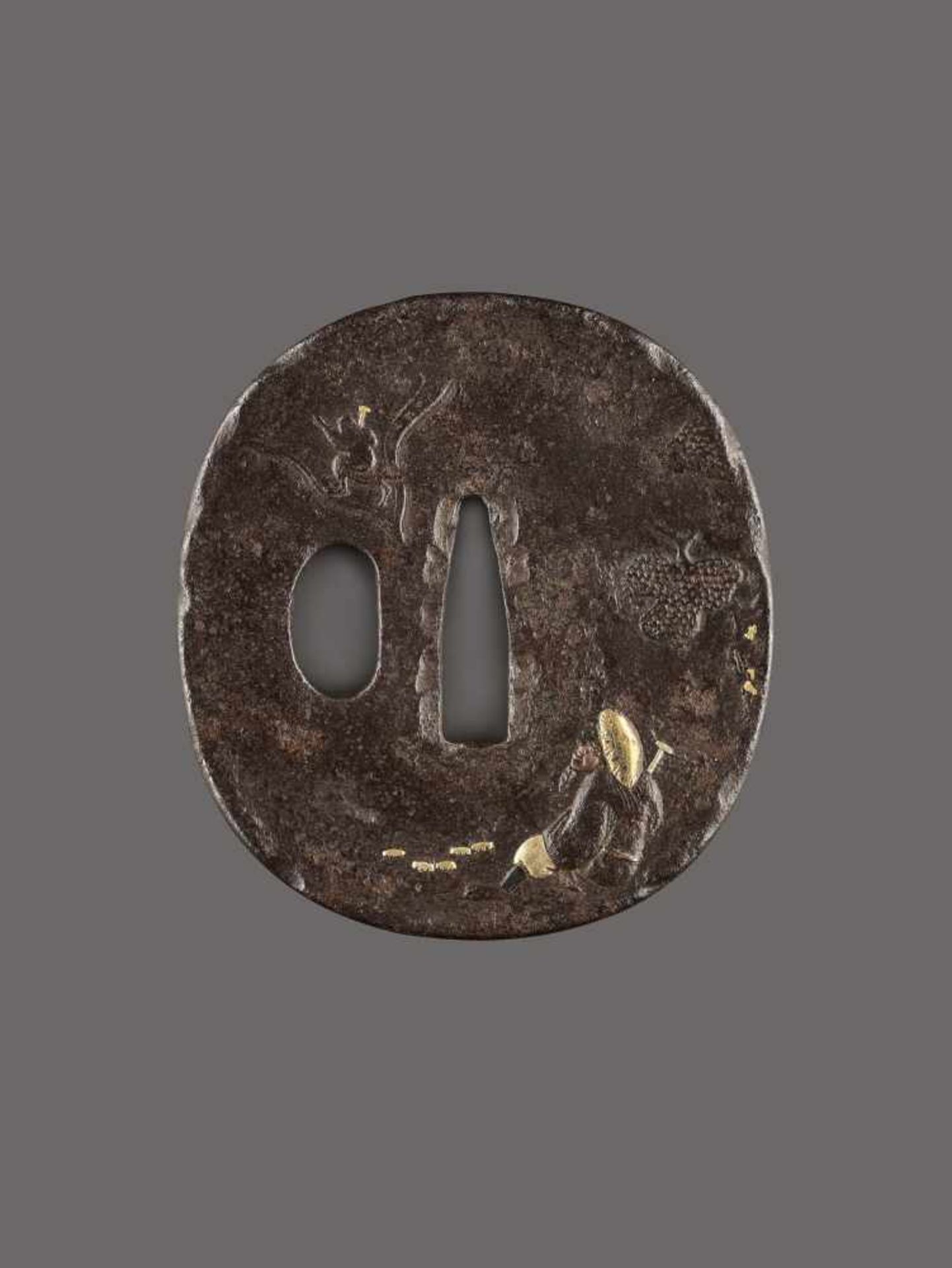 A FINE IRON TSUBA WITH SARUMAWASHI Iron with gold and copperJapan, Edo period (1615-1868)Of Naga