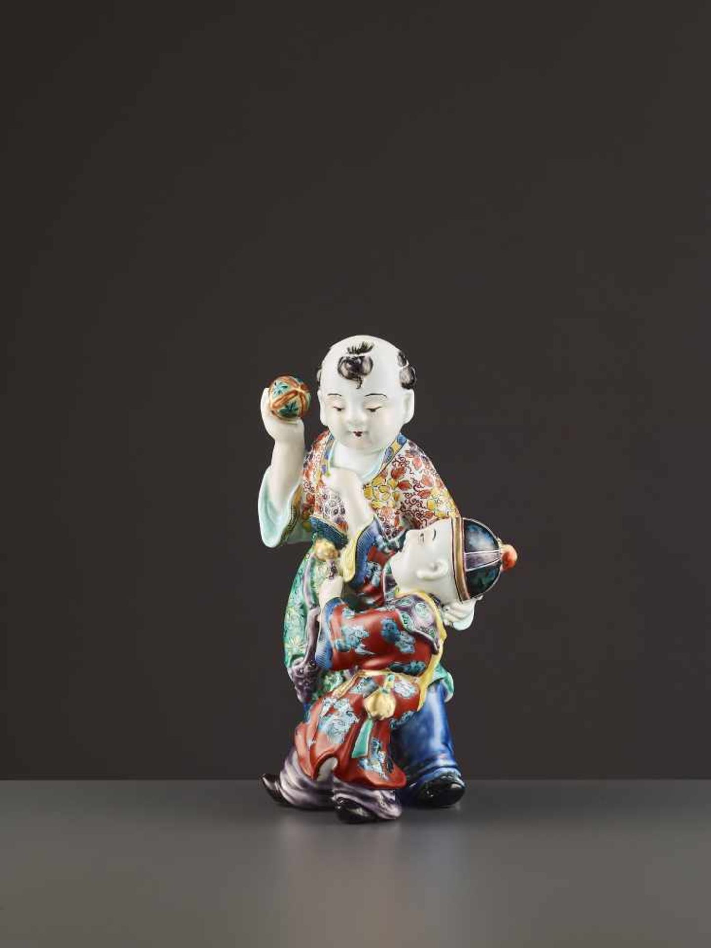 AN ARITA PORCELAIN KARAKO FIGURE Japan, Meiji period (1868-1912). Neatly potted porcelain statue - Image 3 of 9