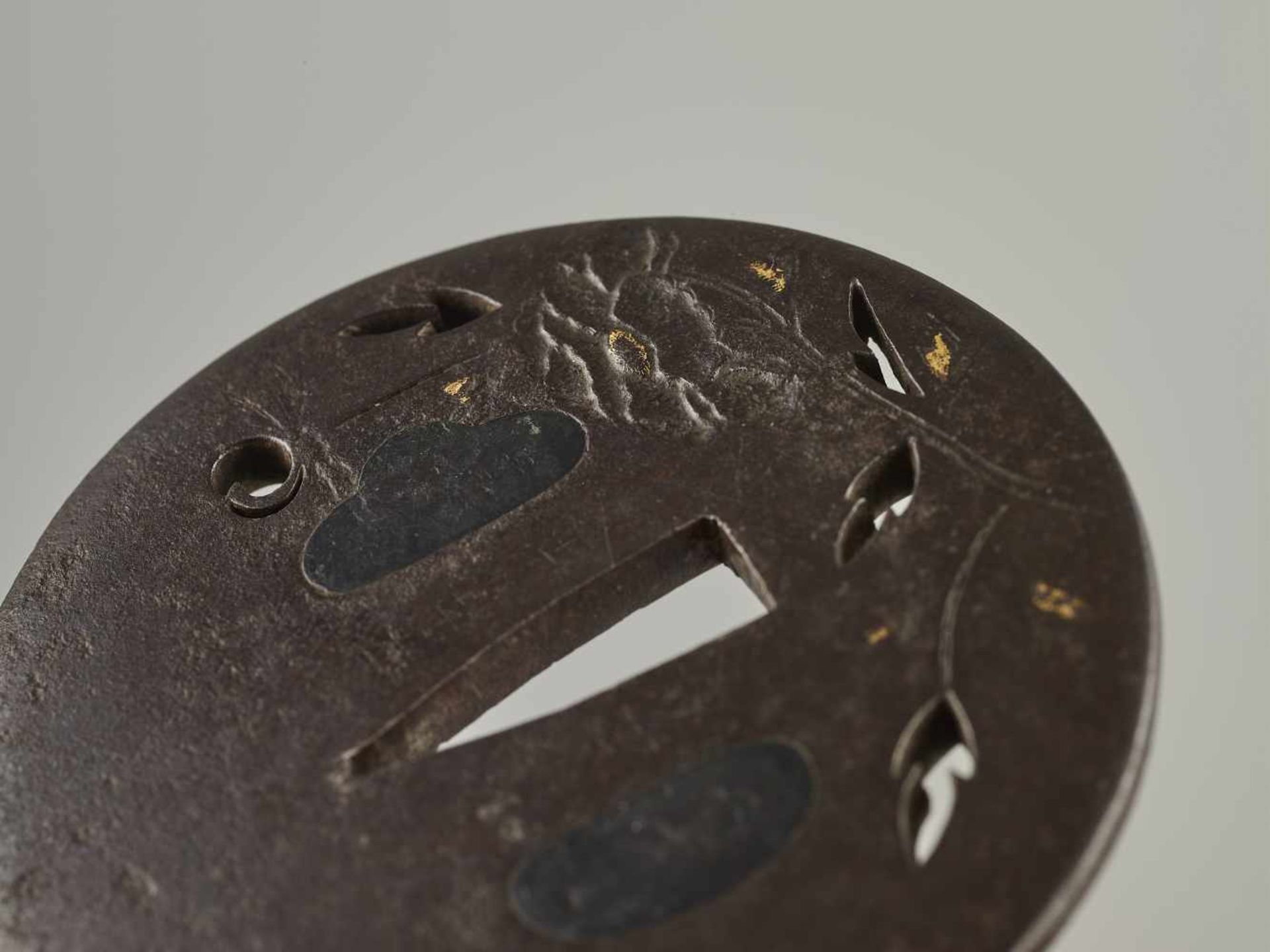 A SIGNED IRON TSUBA WITH LOTUS Signed, iron with goldJapan, Edo period (1615-1868)Of Maru Gata shape - Image 2 of 3