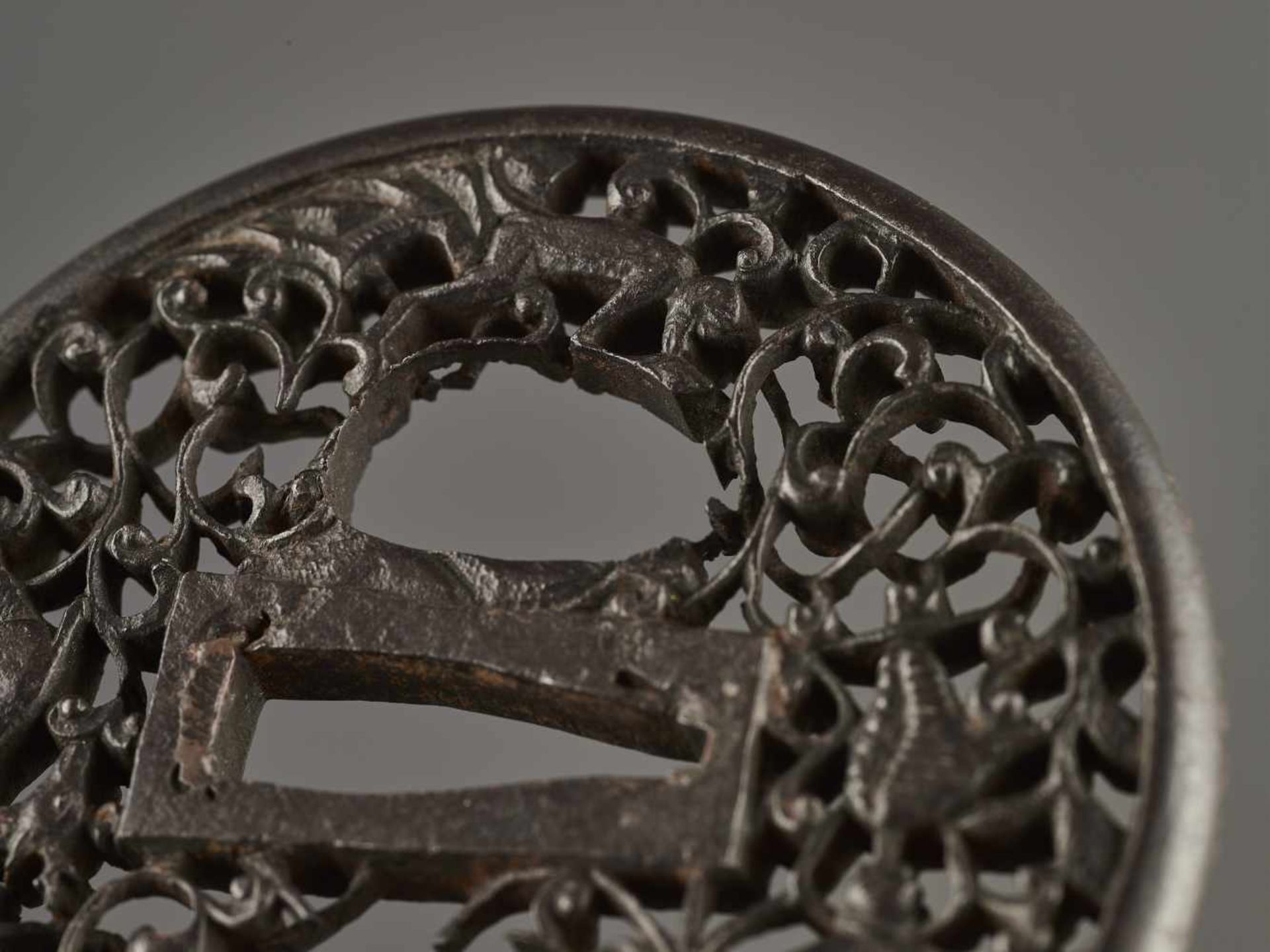 AN IRON TSUBA WITH MONKEY, LOTUS AND DEER Unsigned, patinated ironJapan, Edo period (1615-1868)Of - Image 3 of 4