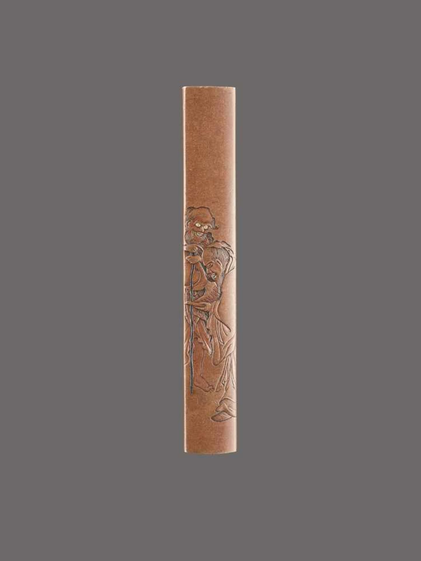 A COPPER KOZUKA HANDLE OF TWO IMMORTALS BY NAOYUKI By Naoyuki, kozuka handle, copper and some gold