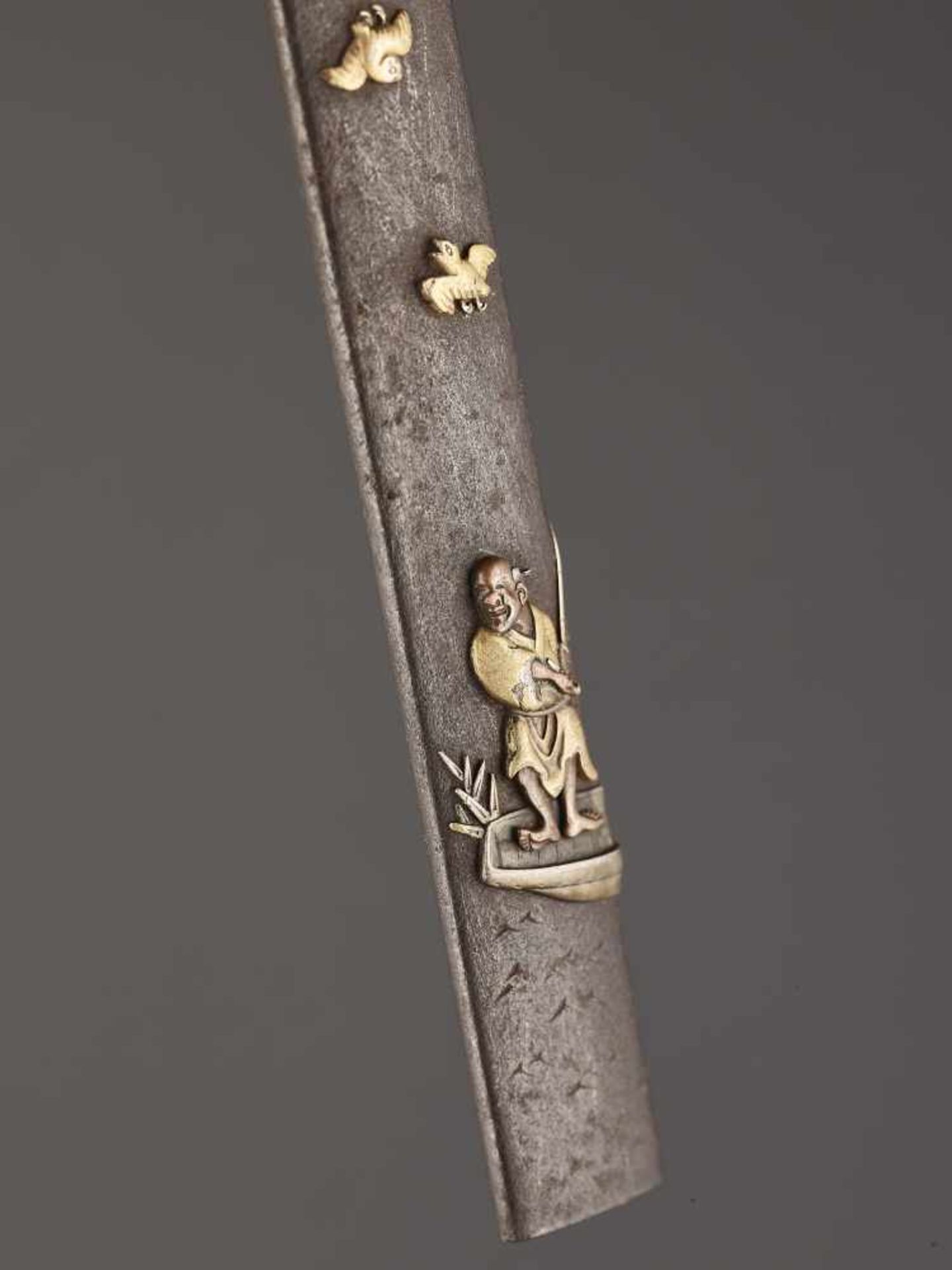 A MIXED METAL KOZUKA HANDLE DEPICTING A FISHERMAN IN A BOAT AND BIRDS Unsigned, kozuka handle, iron, - Image 2 of 3