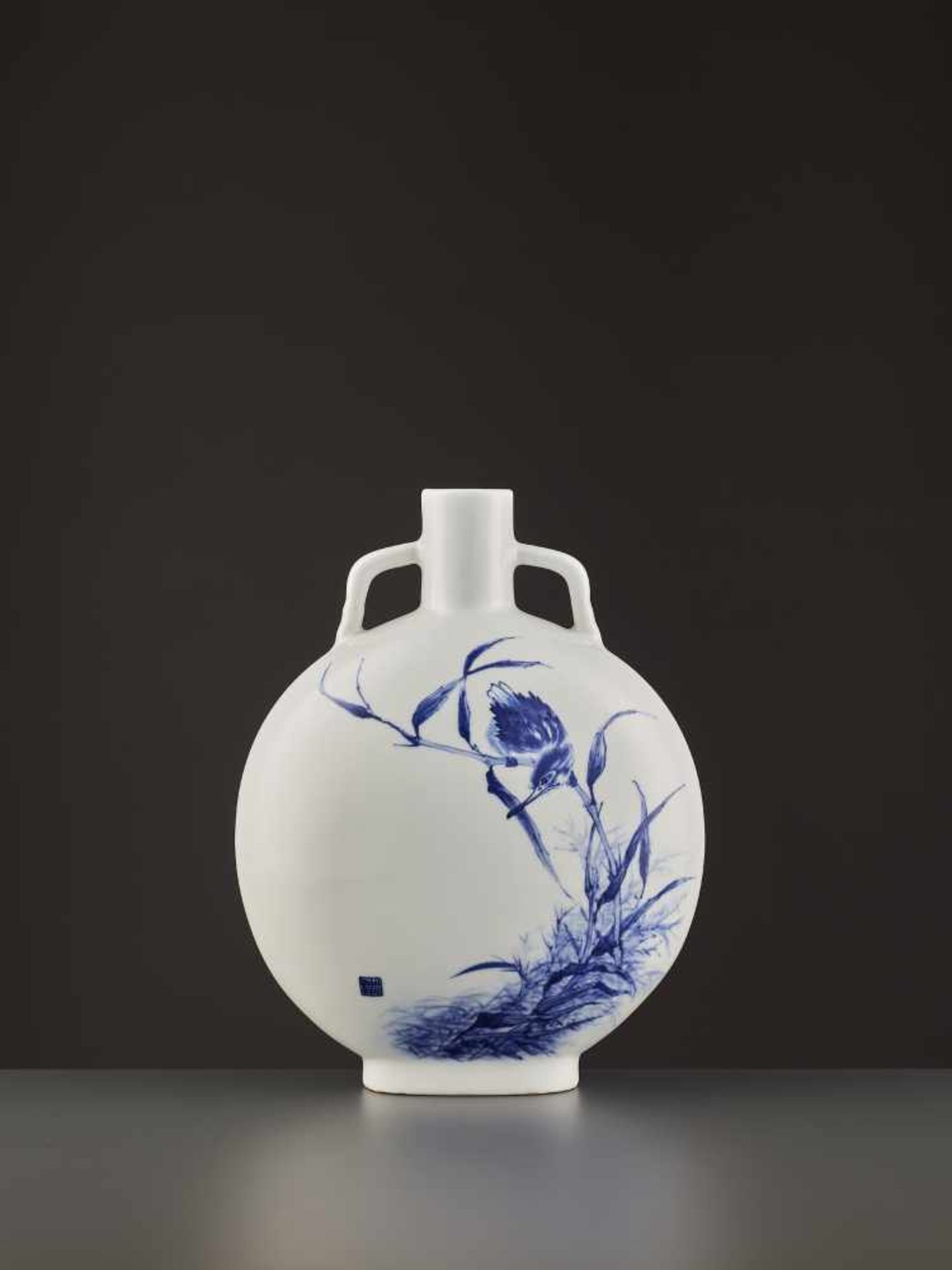 A HIRADO PORCELAIN MOONFLASK Japan, 1934. Virtuously painted in underglaze blue on the white