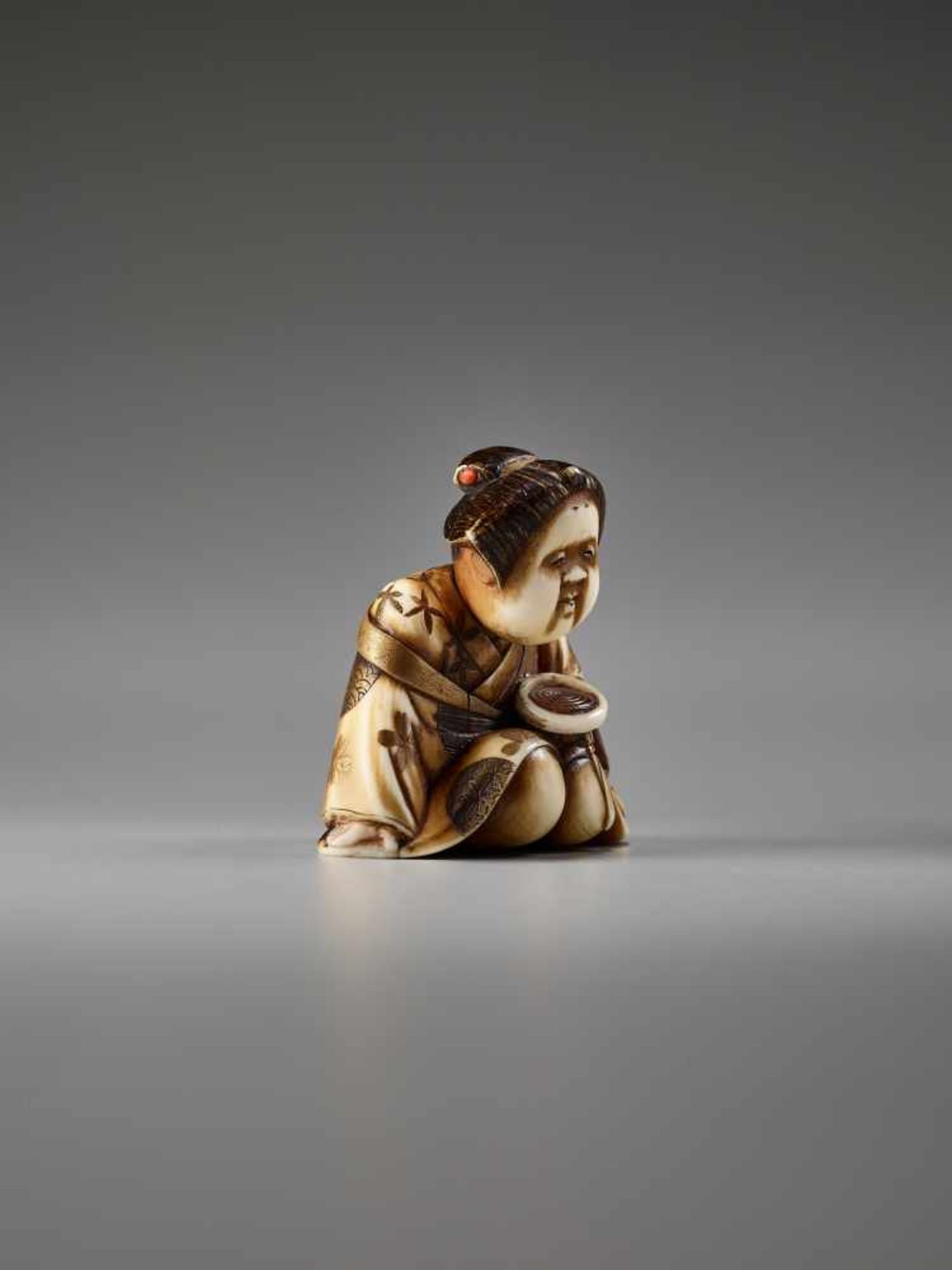 AN IVORY AND LACQUER NETSUKE OF OKAME WITH A SAKE CUP BY KEIMIN By Keimin, ivory netsuke with gold - Image 5 of 7