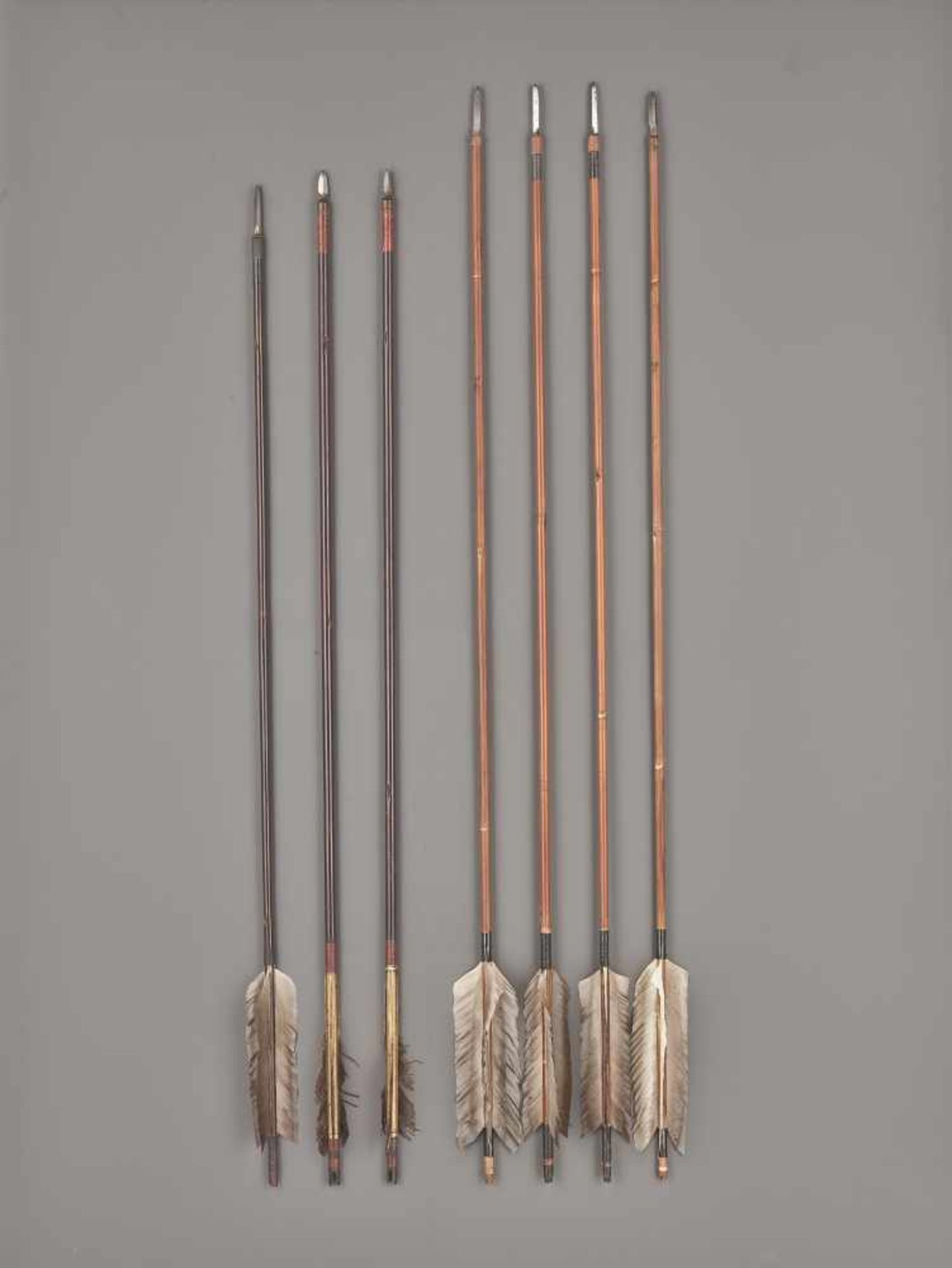 A RARE GROUP OF SEVEN YA (ARROWS) Bamboo shafts with feathers and steel arrow headsJapan, 19th