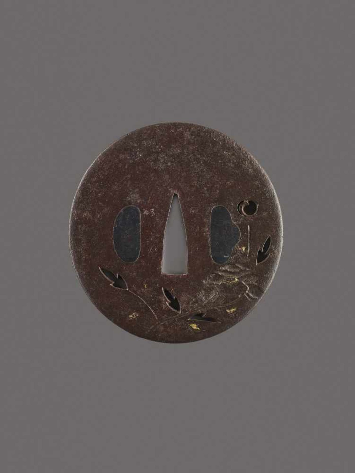 A SIGNED IRON TSUBA WITH LOTUS Signed, iron with goldJapan, Edo period (1615-1868)Of Maru Gata shape