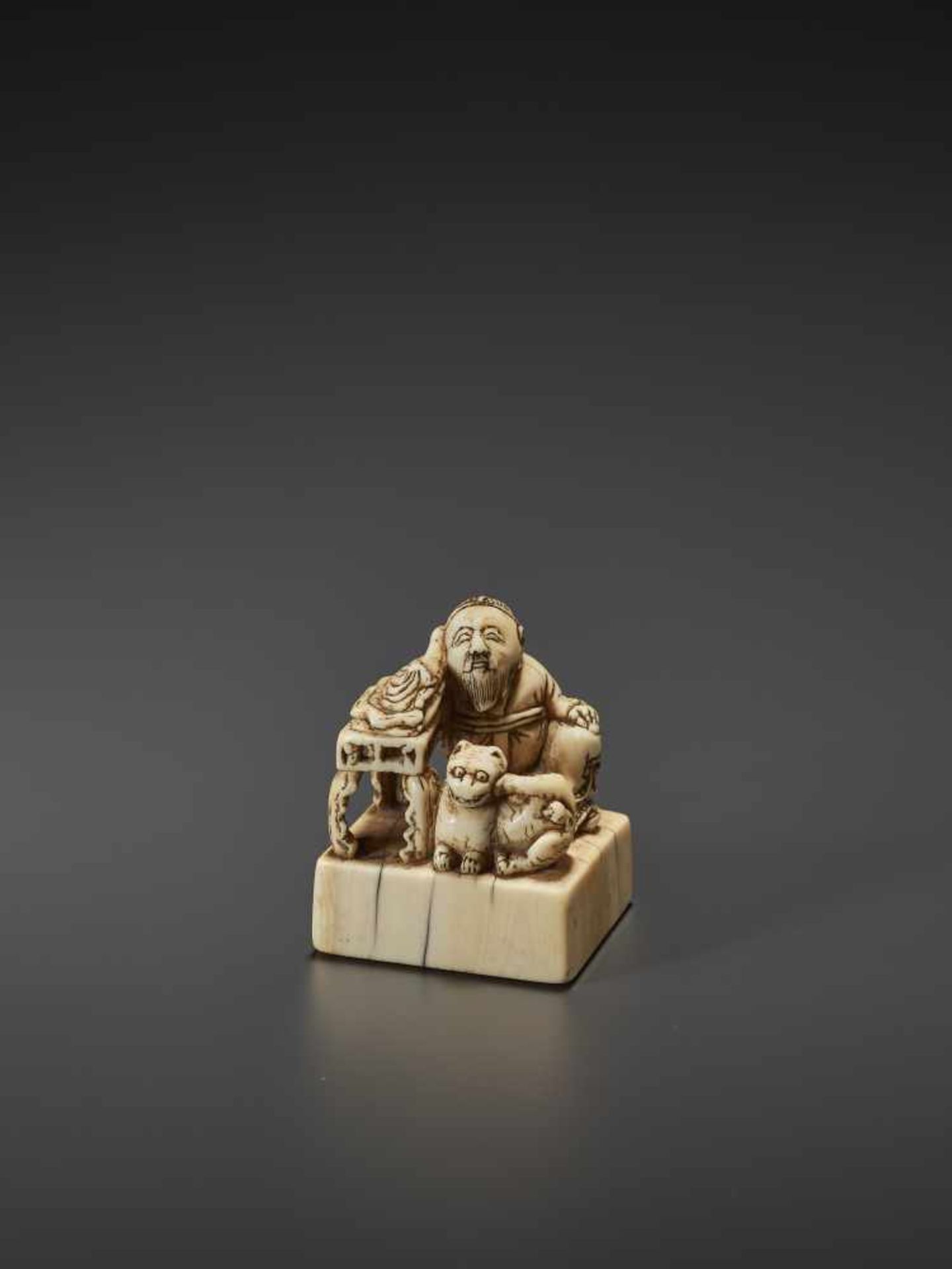 AN UNUSUAL AND EARLY IVORY NETSUKE OF A CHINESE SAGE WITH TIGER Unsigned, ivory netsukeJapan, 18th