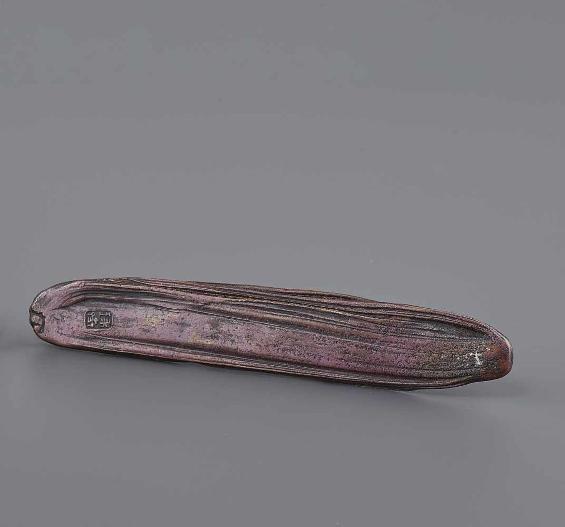 A BRONZE SCROLL WEIGHT BY TAKUSAI  Japan, Meiji period (1868-1912). Artist seal of Honma Takusai III - Image 9 of 11