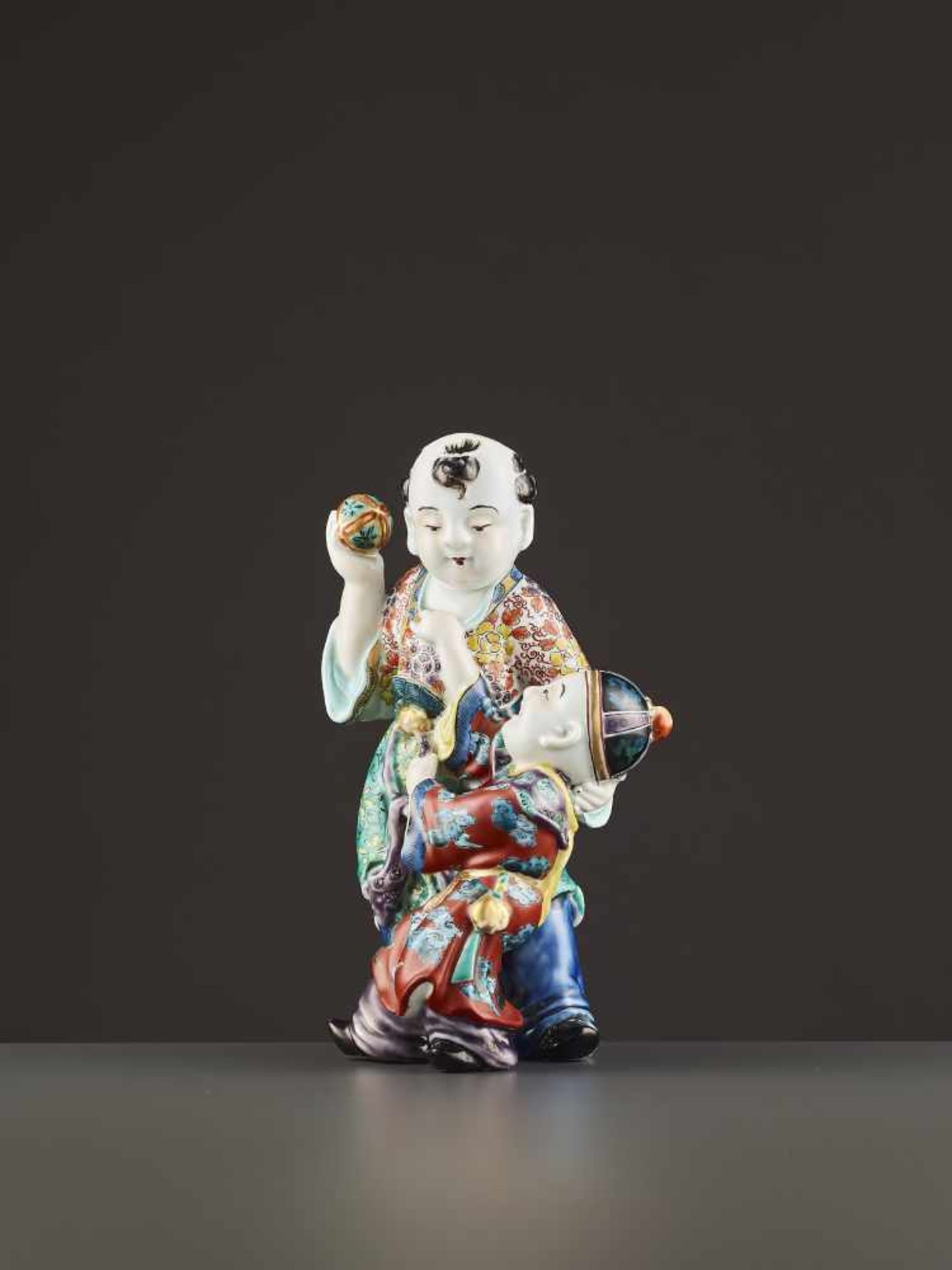 AN ARITA PORCELAIN KARAKO FIGURE Japan, Meiji period (1868-1912). Neatly potted porcelain statue - Image 5 of 9