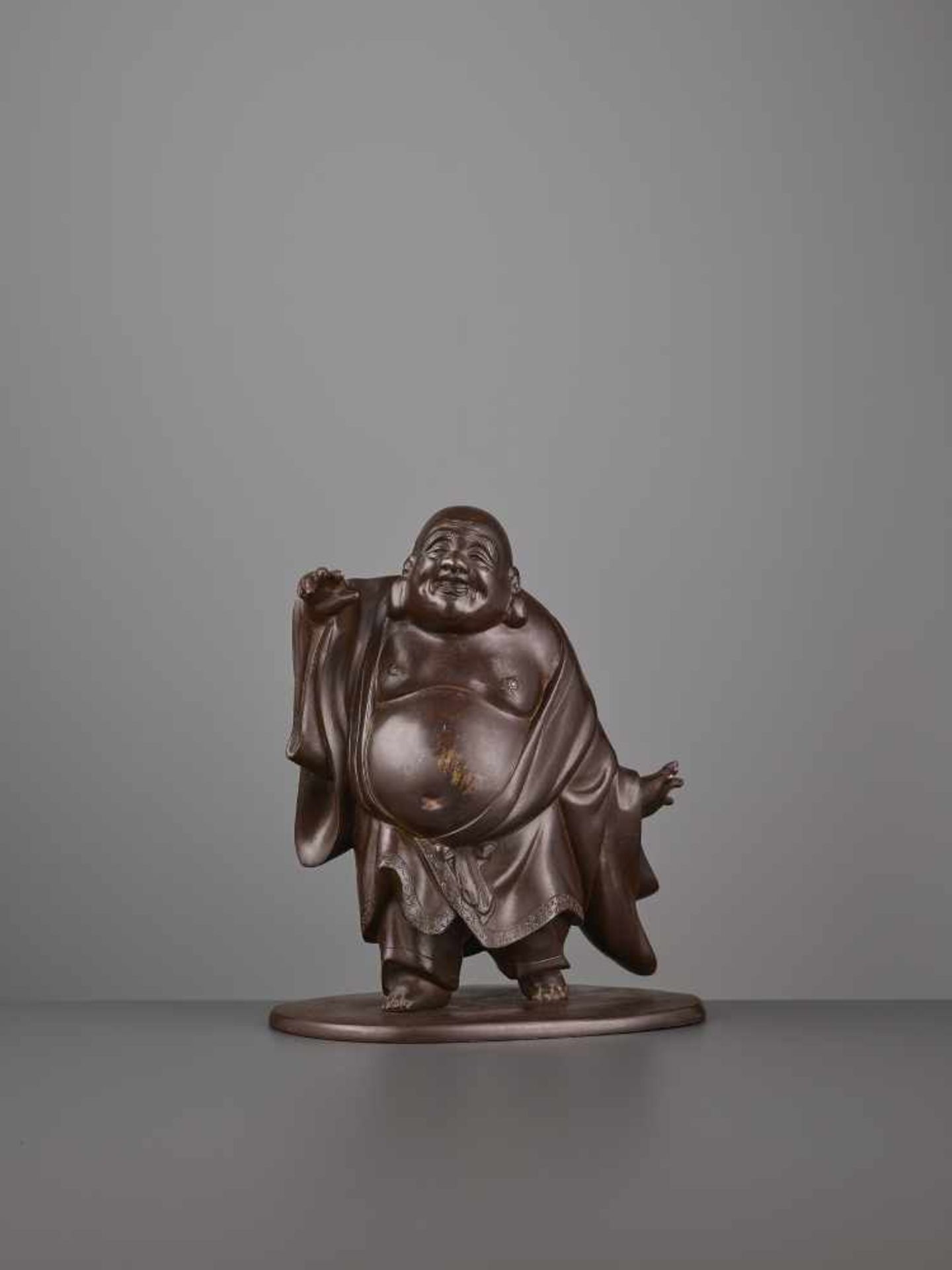 A CHARMING BRONZE OF HOTEI Japan, Meiji period (1868-1912). The bronze figure with a subtle maroon - Image 3 of 8