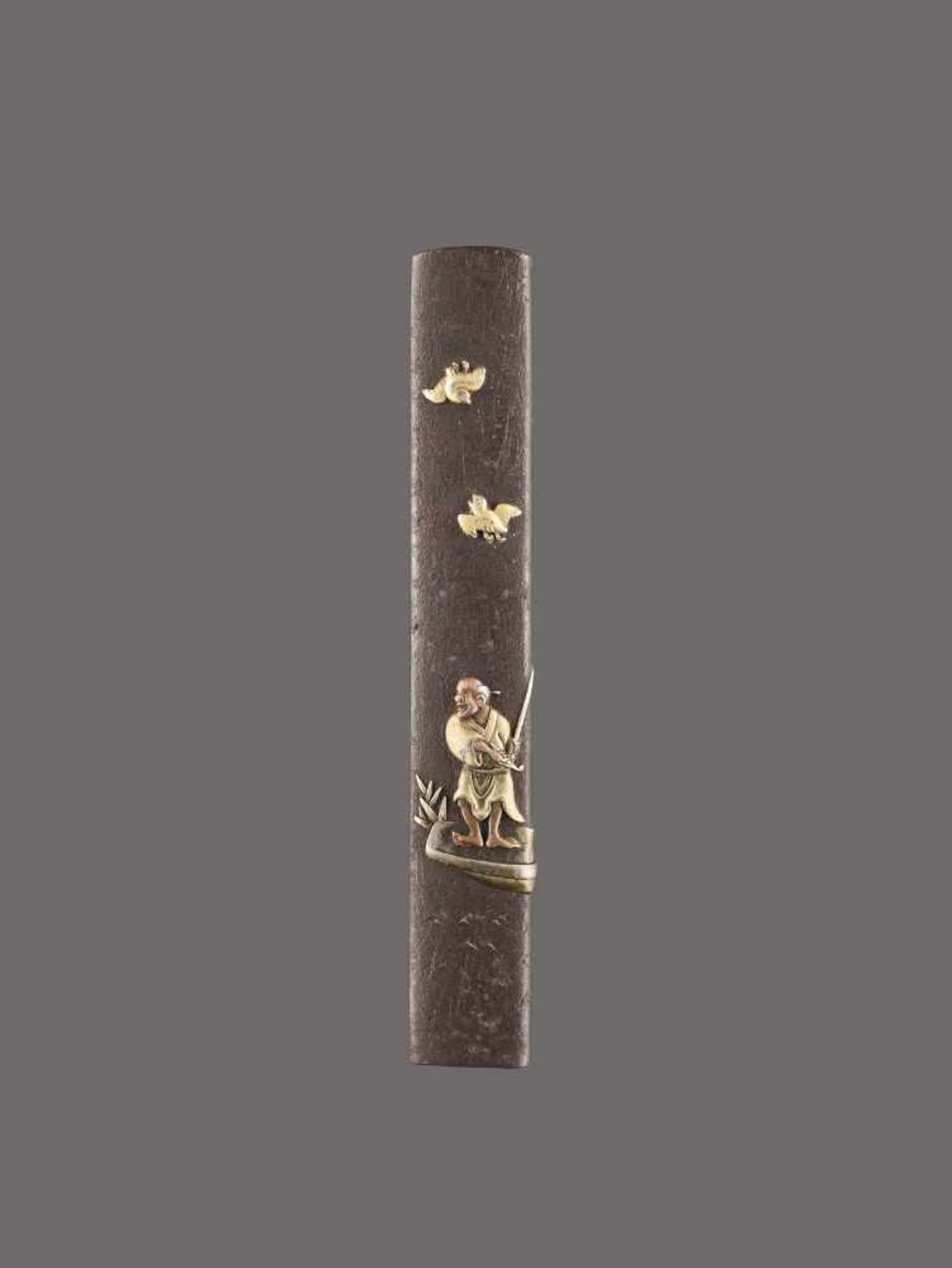 A MIXED METAL KOZUKA HANDLE DEPICTING A FISHERMAN IN A BOAT AND BIRDS Unsigned, kozuka handle, iron,