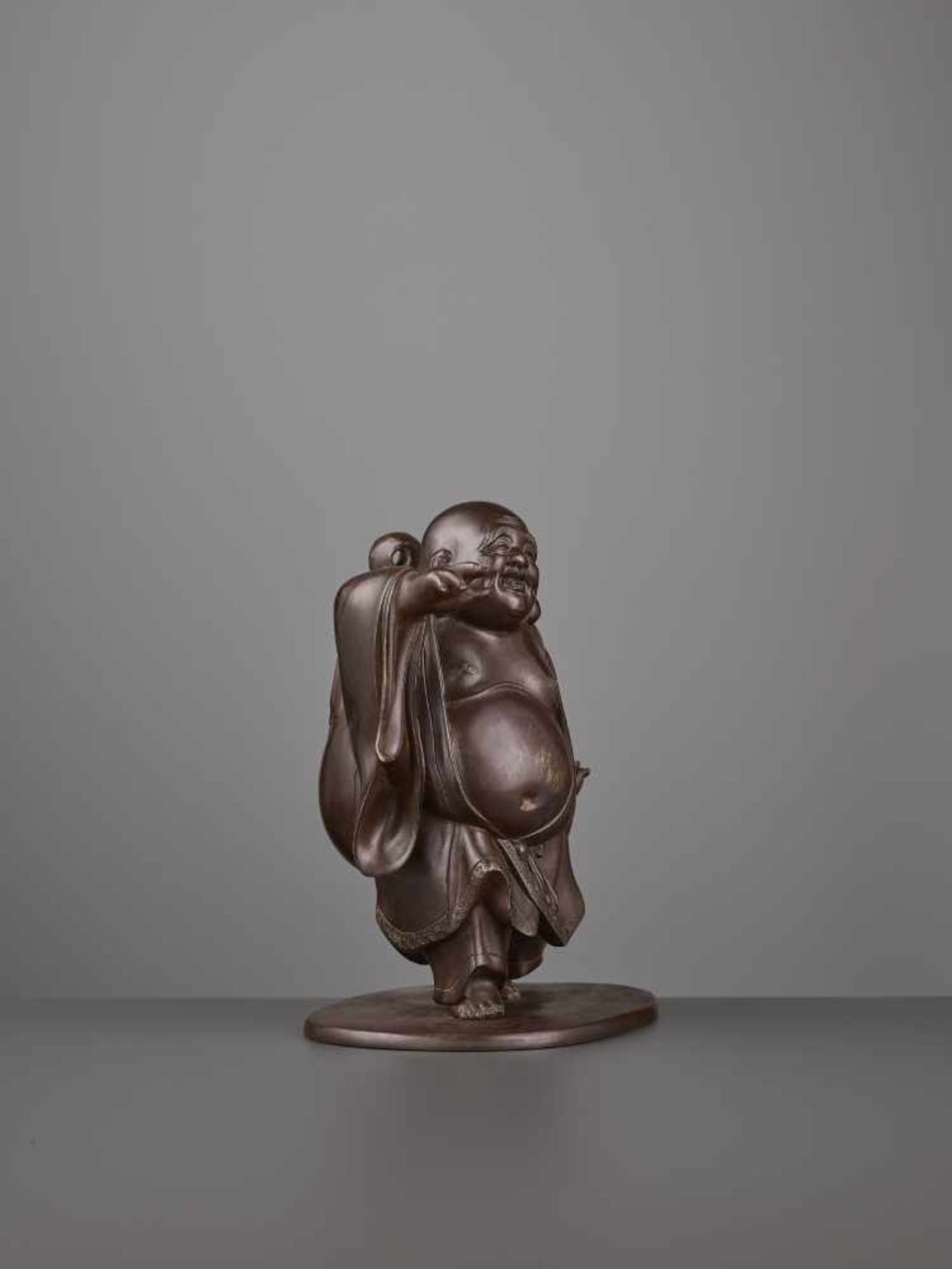 A CHARMING BRONZE OF HOTEI Japan, Meiji period (1868-1912). The bronze figure with a subtle maroon - Image 4 of 8