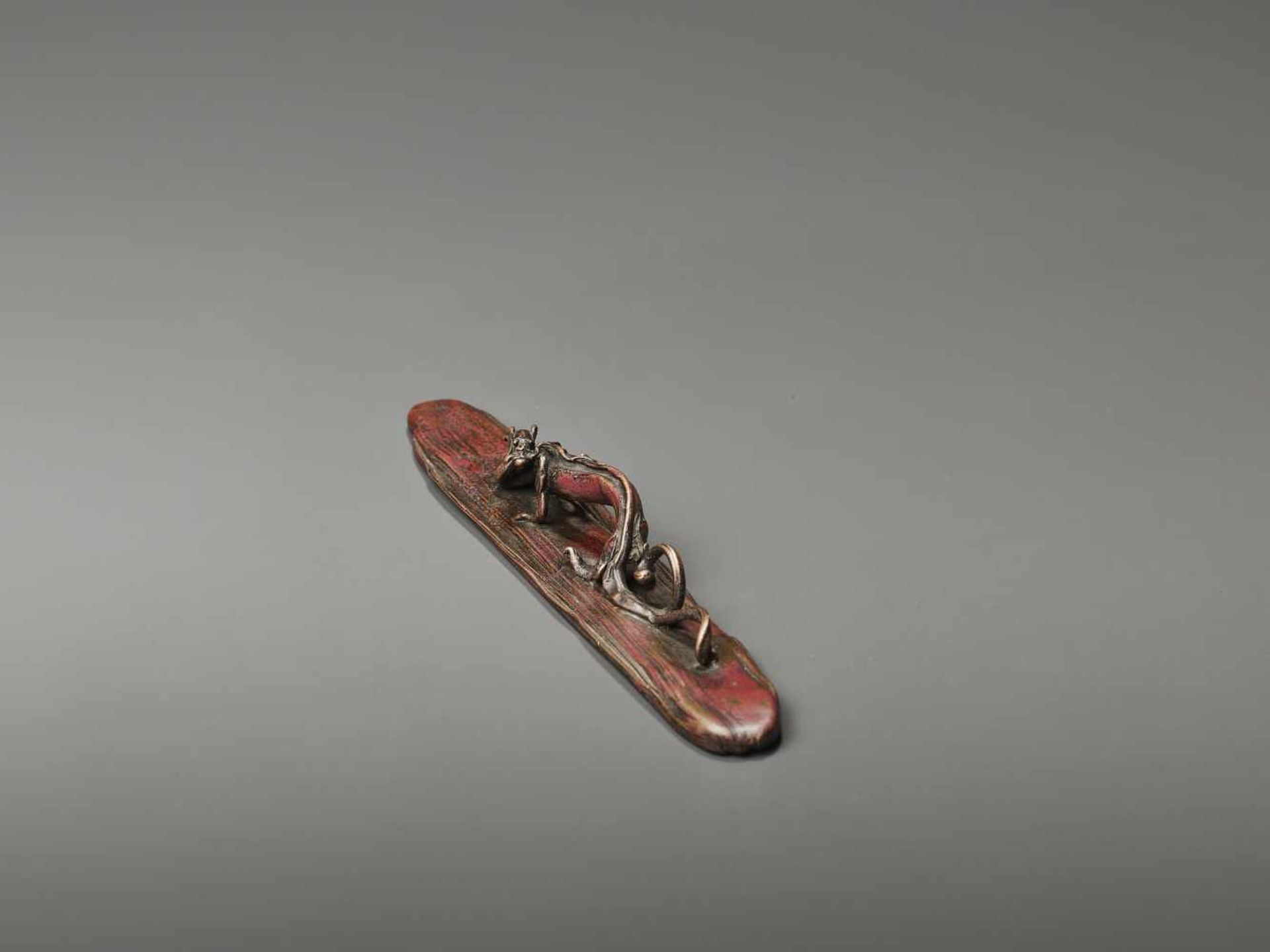 A BRONZE SCROLL WEIGHT BY TAKUSAI  Japan, Meiji period (1868-1912). Artist seal of Honma Takusai III - Image 6 of 11