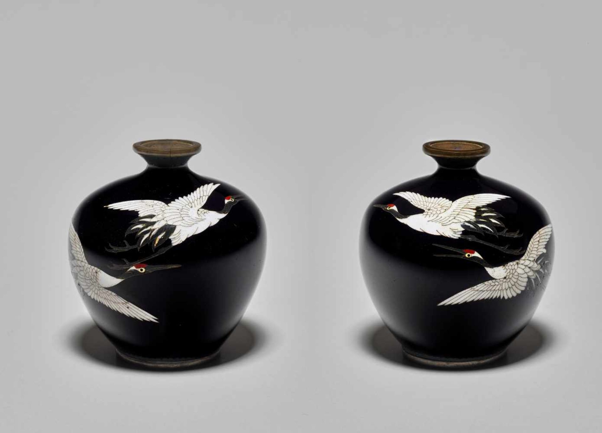PAIR OF CLOISONNÉ VASES WITH CRANES Japan, Meiji period (1868-1912). A pair of cloisonné vases