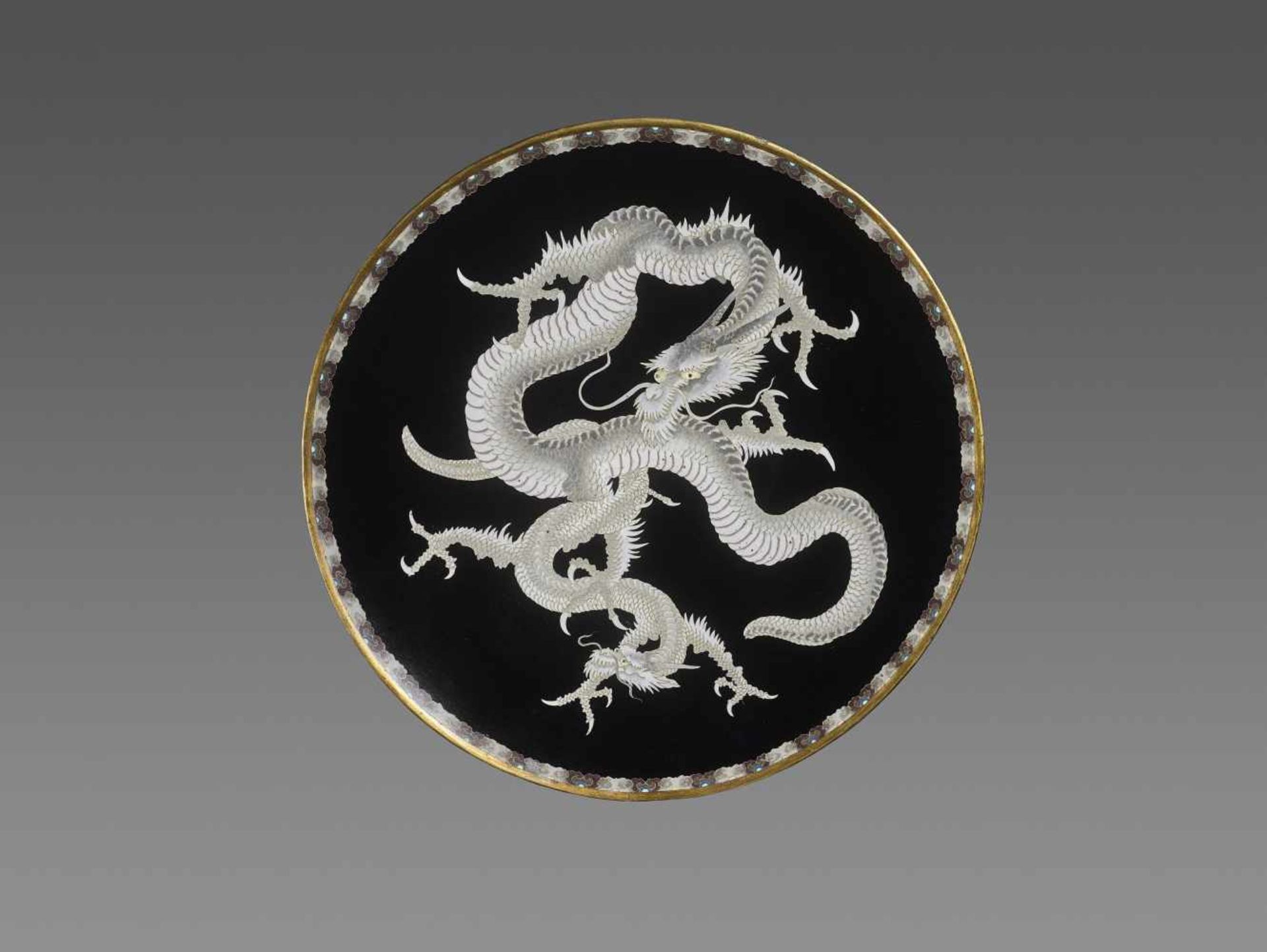 A DRAMATIC CLOISONNÉ DRAGON PLATE, MEIJI Japan, ca. 1880. The fine plate with two coiled dragons