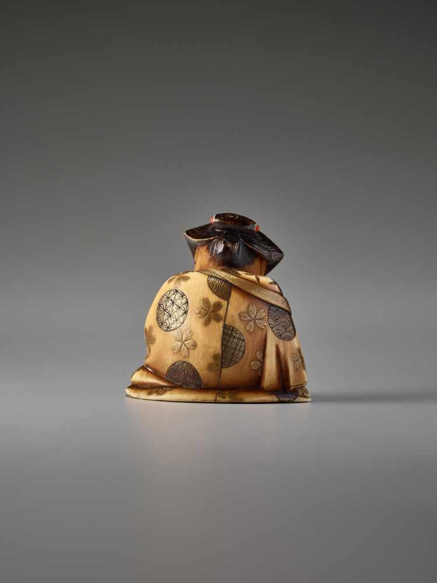 AN IVORY AND LACQUER NETSUKE OF OKAME WITH A SAKE CUP BY KEIMIN By Keimin, ivory netsuke with gold - Image 2 of 7