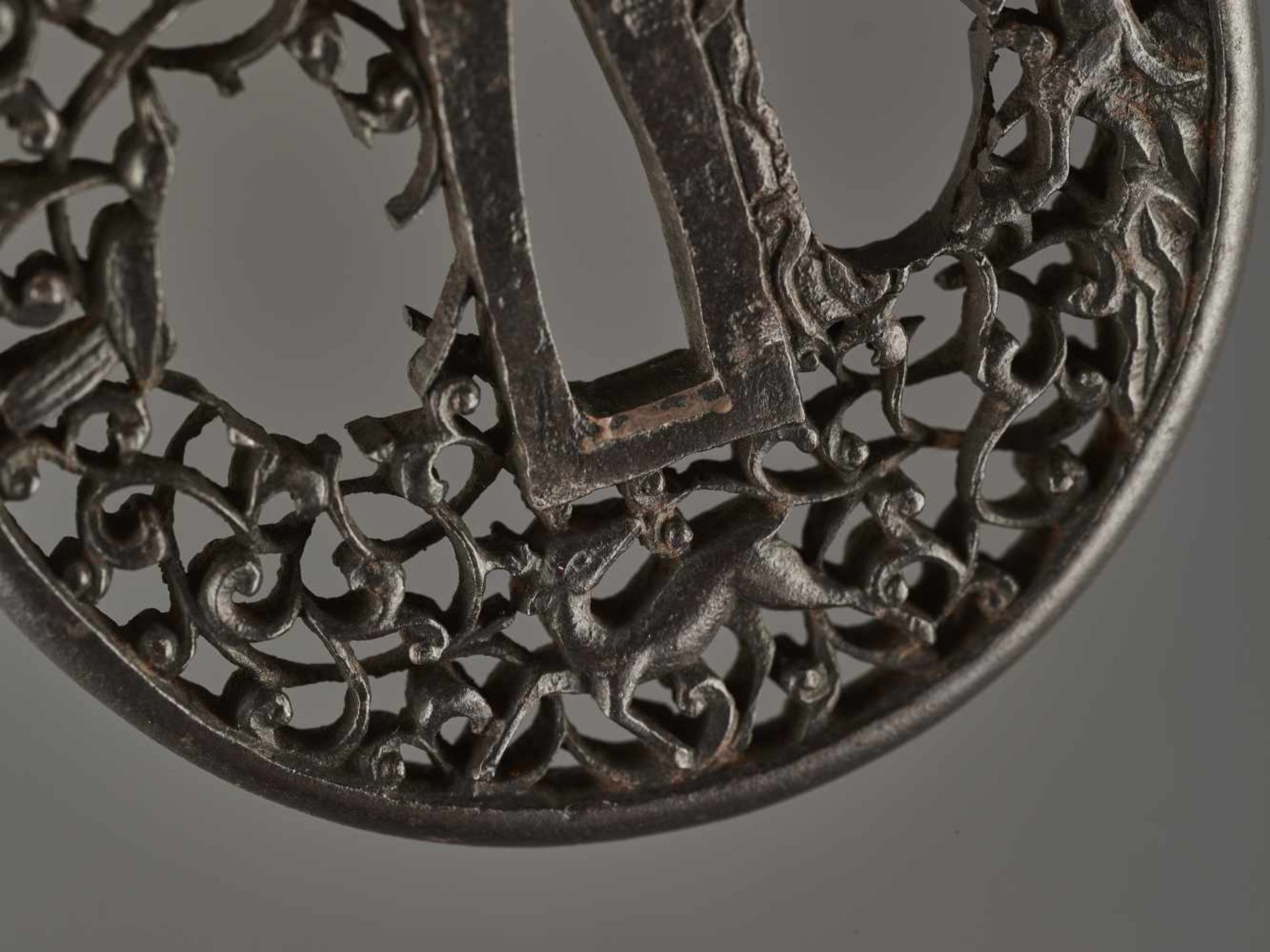 AN IRON TSUBA WITH MONKEY, LOTUS AND DEER Unsigned, patinated ironJapan, Edo period (1615-1868)Of - Image 2 of 4