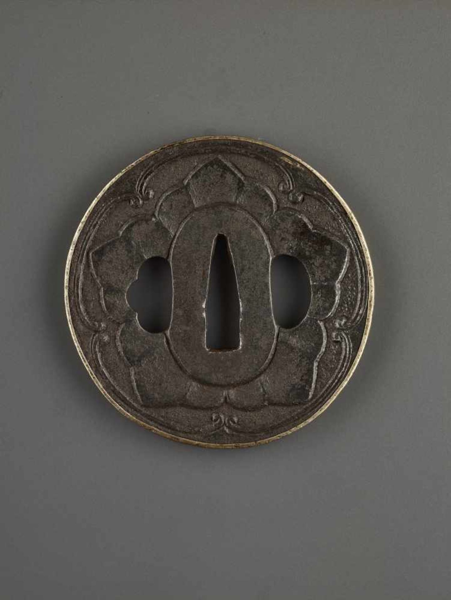 AN IRON TSUBA WITH MON CREST IronJapan, Edo period (1615-1868)Of Maru Gata shape with a raised and - Image 4 of 4