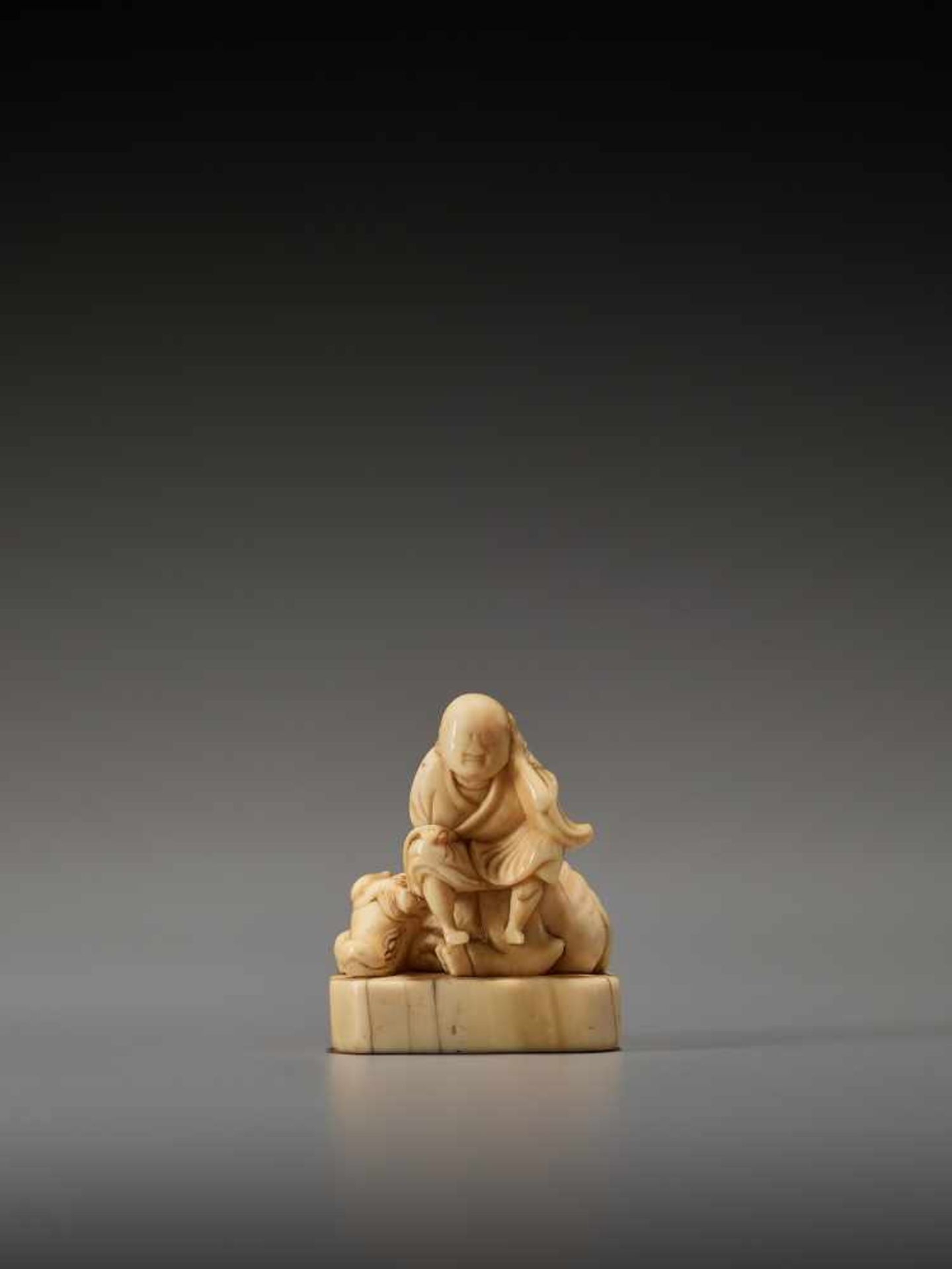 AN EARLY IVORY NETSUKE OF AN OX HERDER Unsigned, ivory netsuke Japan, mid-18th century, Edo