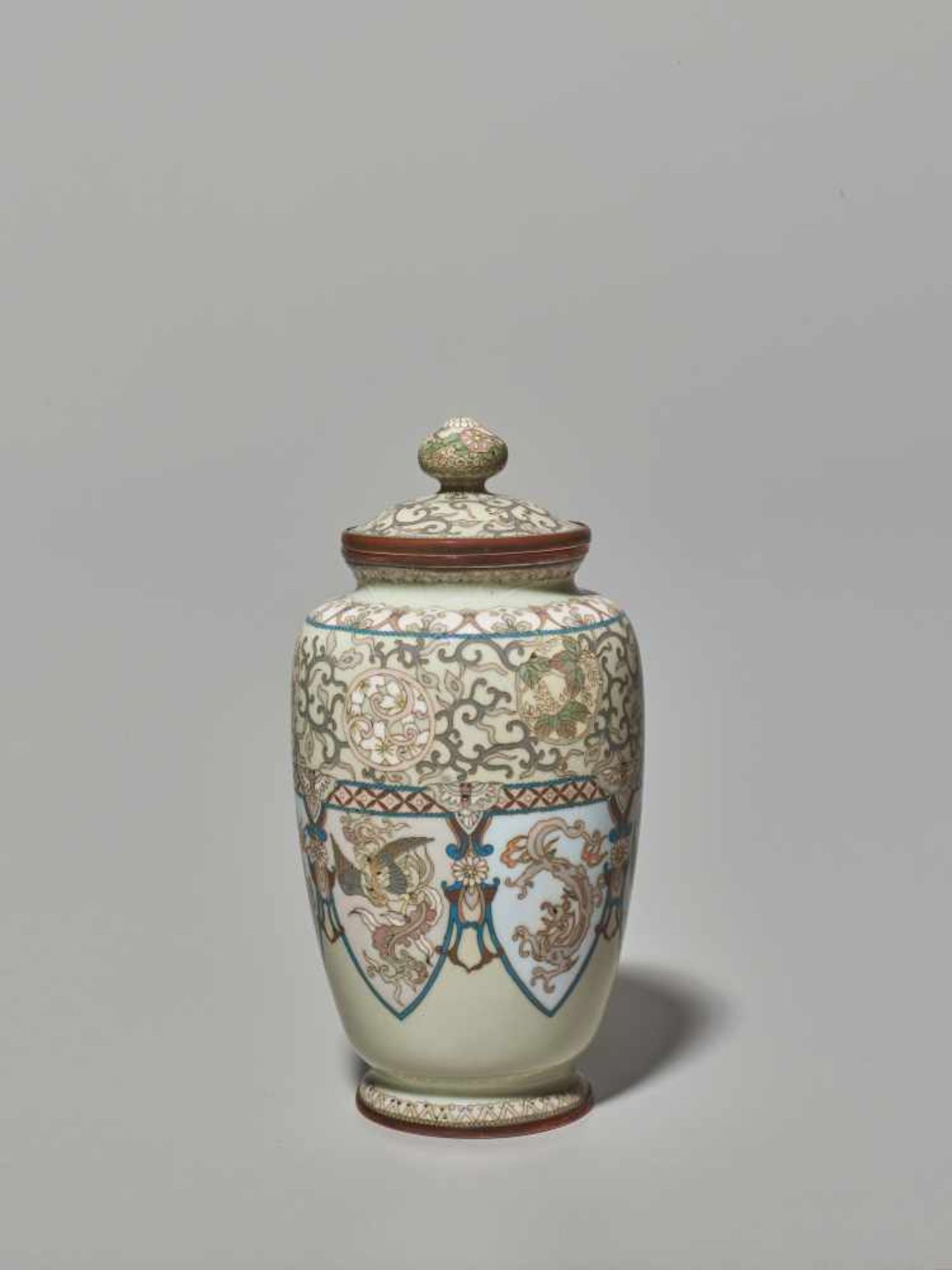 A LIDDED CLOISONNÉ VASE Japan, Meiji period (1868-1912). Baluster shaped vase with a slim body,