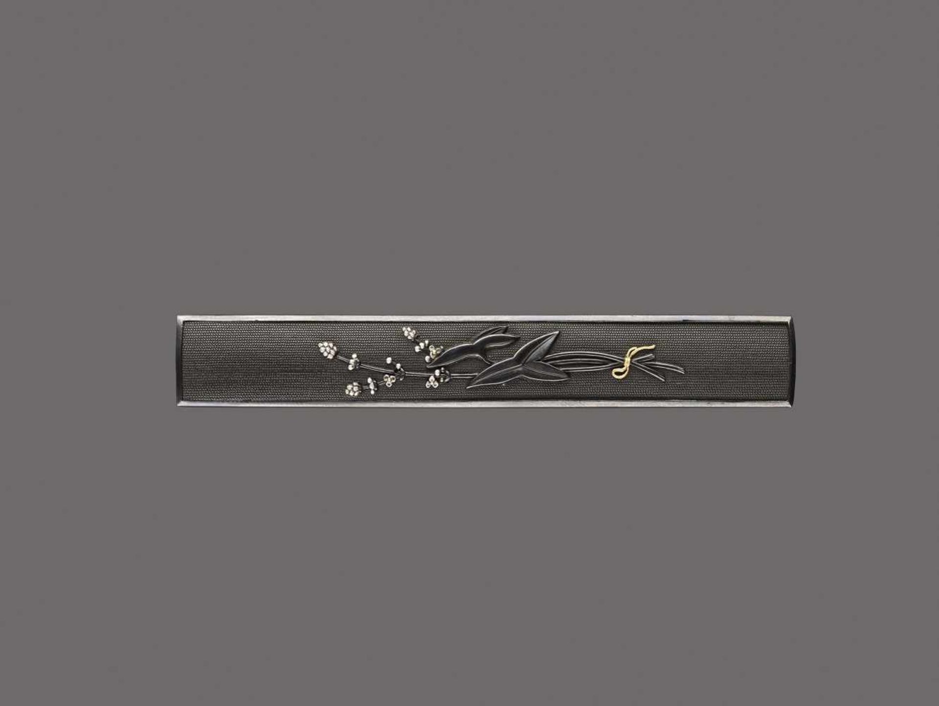 A SHIBUICHI KOZUKA WITH OMODAKA Unsigned, shibuichi kozuka with silver and goldJapan, 19th