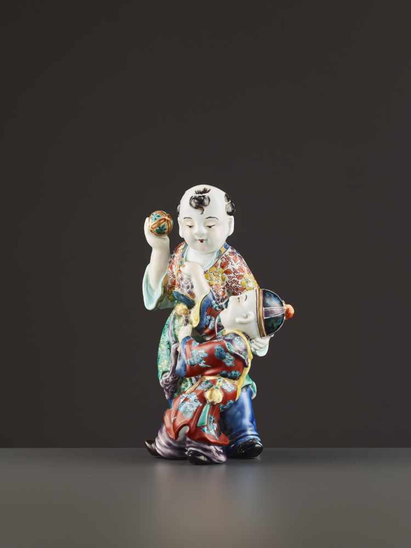 AN ARITA PORCELAIN KARAKO FIGURE Japan, Meiji period (1868-1912). Neatly potted porcelain statue - Image 4 of 9