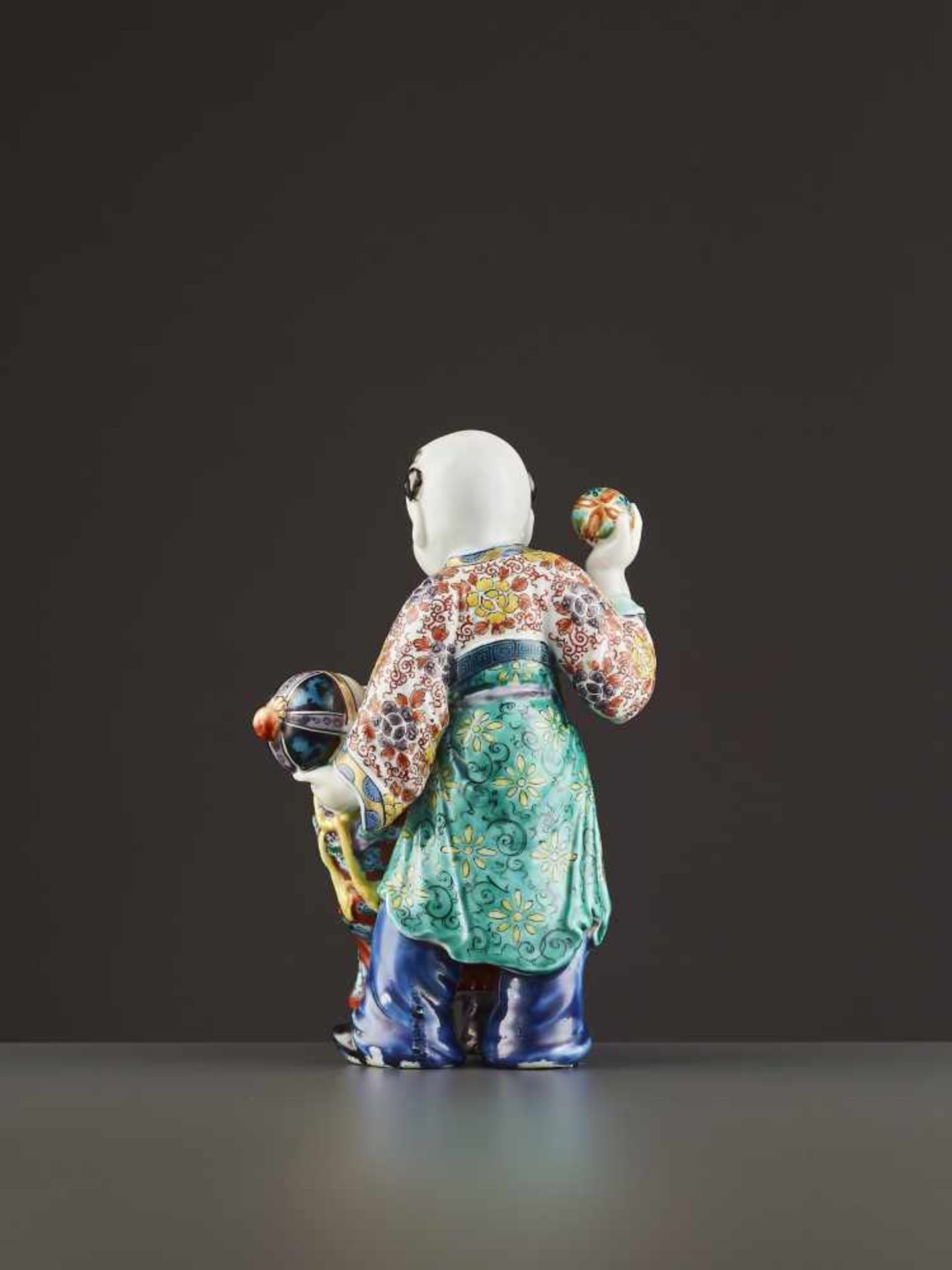 AN ARITA PORCELAIN KARAKO FIGURE Japan, Meiji period (1868-1912). Neatly potted porcelain statue - Image 7 of 9