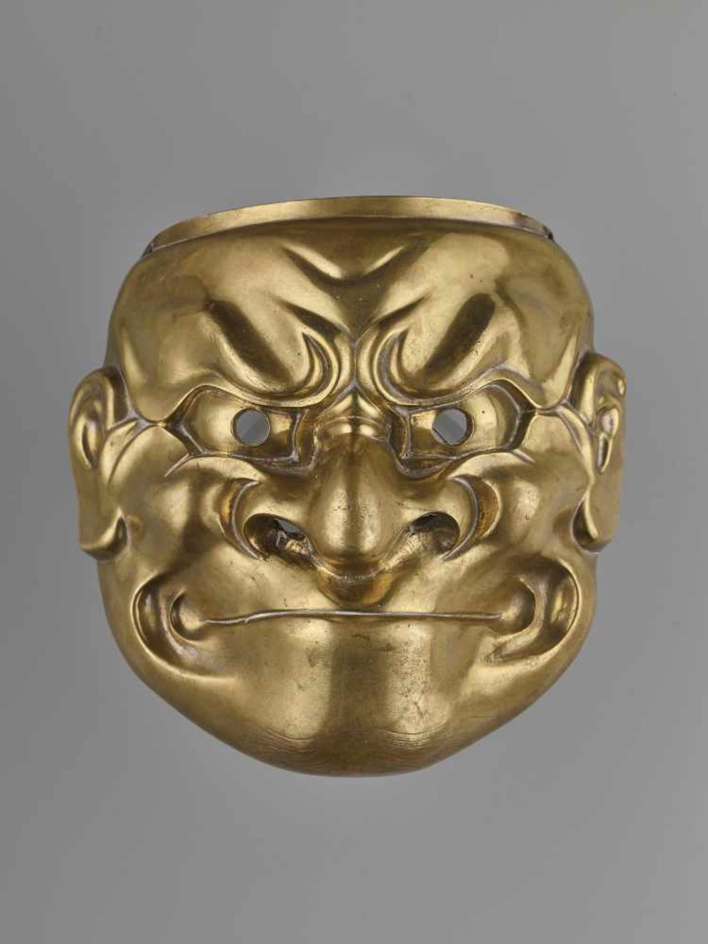 A LARGE BRONZE O-BESHIMI MASK Japan, 18th – 19th century. Massively cast bronze with openwork at the