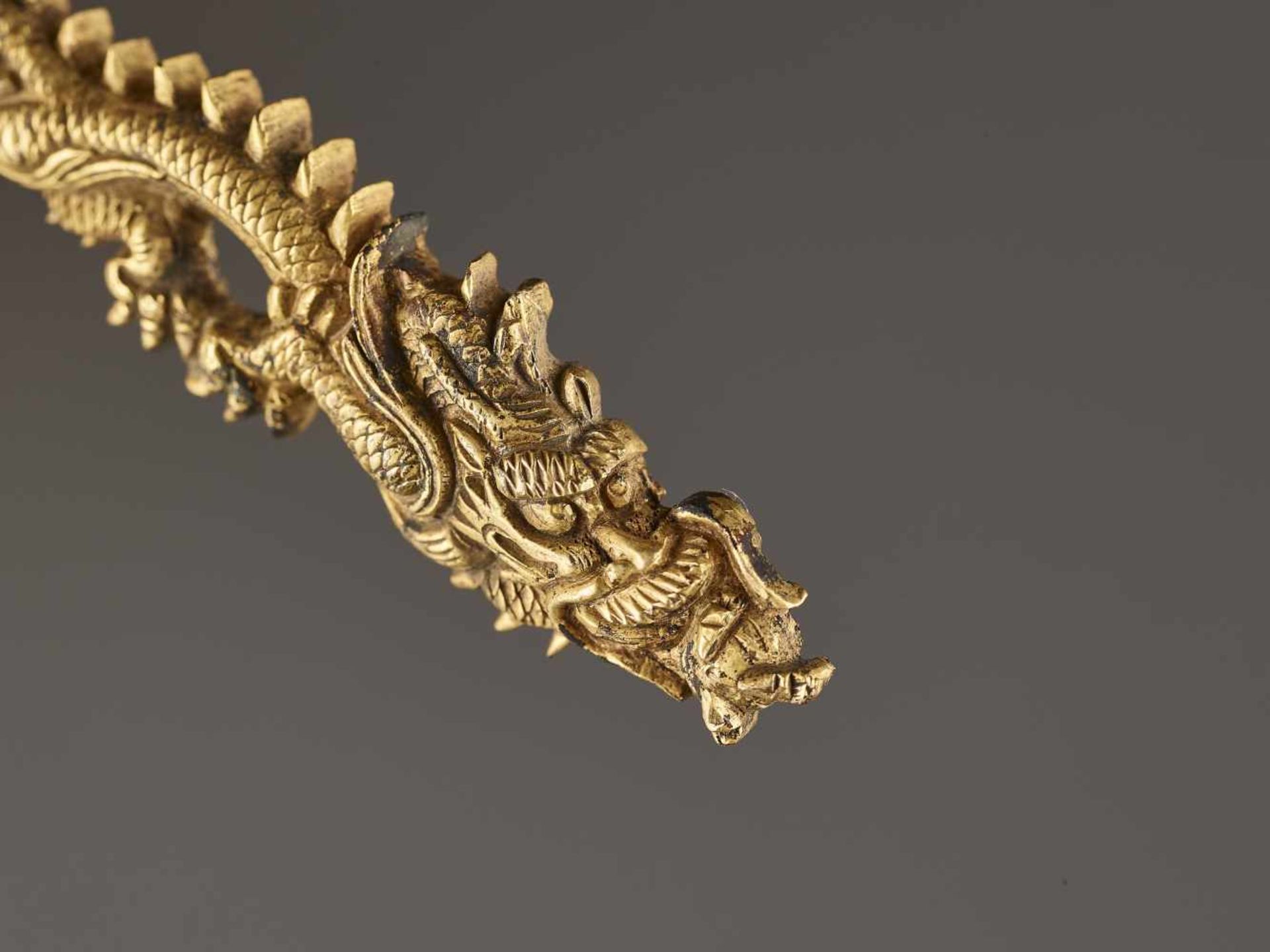 A PAIR OF GILT SHAKUDO DRAGON MENUKI Unsigned, gilt shakudoJapan, Edo period (1615-1868)Each - Image 3 of 4