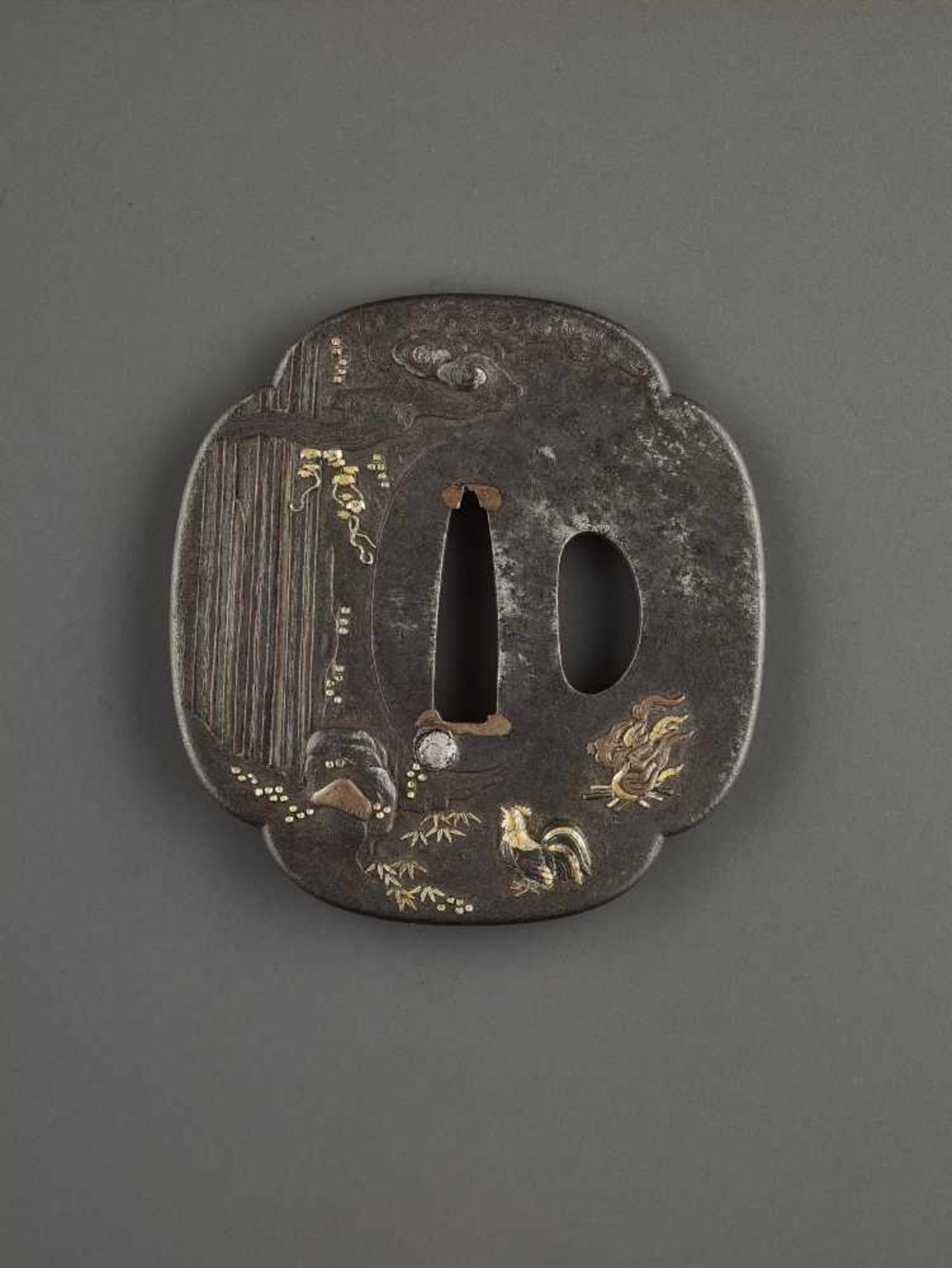 AN IRON, COPPER AND GOLD TSUBA DEPICTING FUDO AND COMPANION Unsigned, tsuba, iron, copper and gold - Image 2 of 4