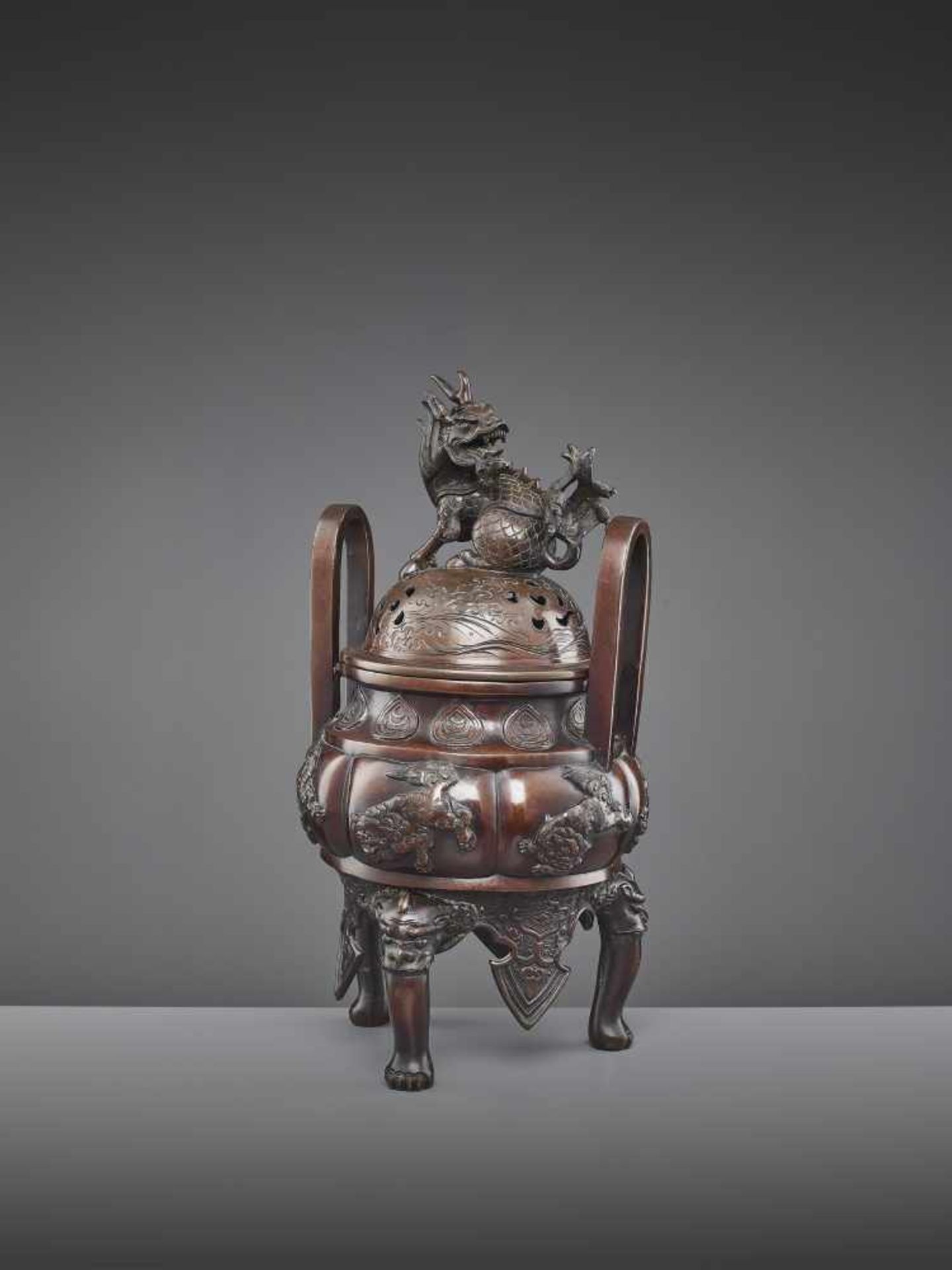 A BUDDHIST BRONZE CENSER 19TH CENTURY Japan, 1860-1910. The heavily cast vessel with six Buddhist